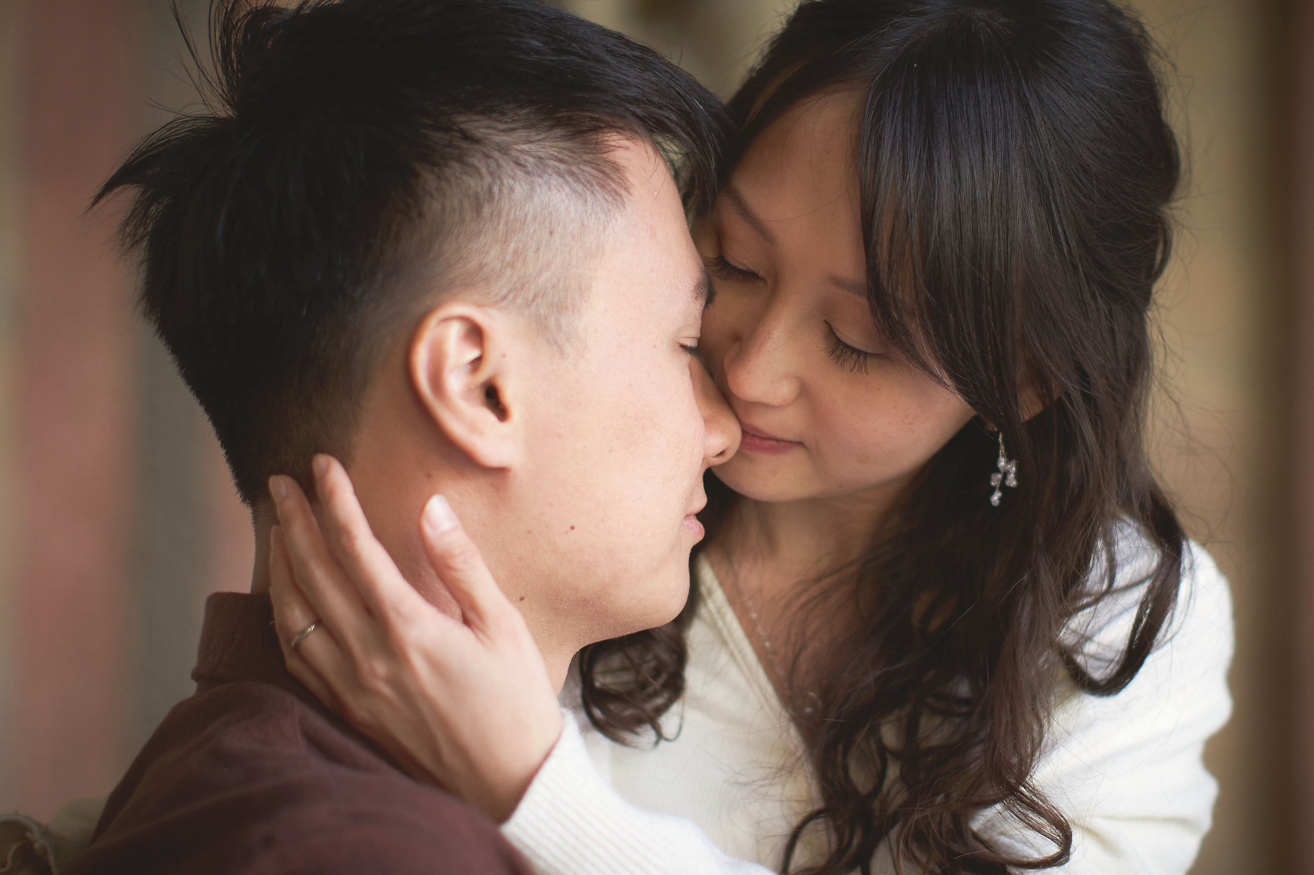 Close-up intimate embrace of Eva and Conan at the end of the pre-wedding session in Prague.