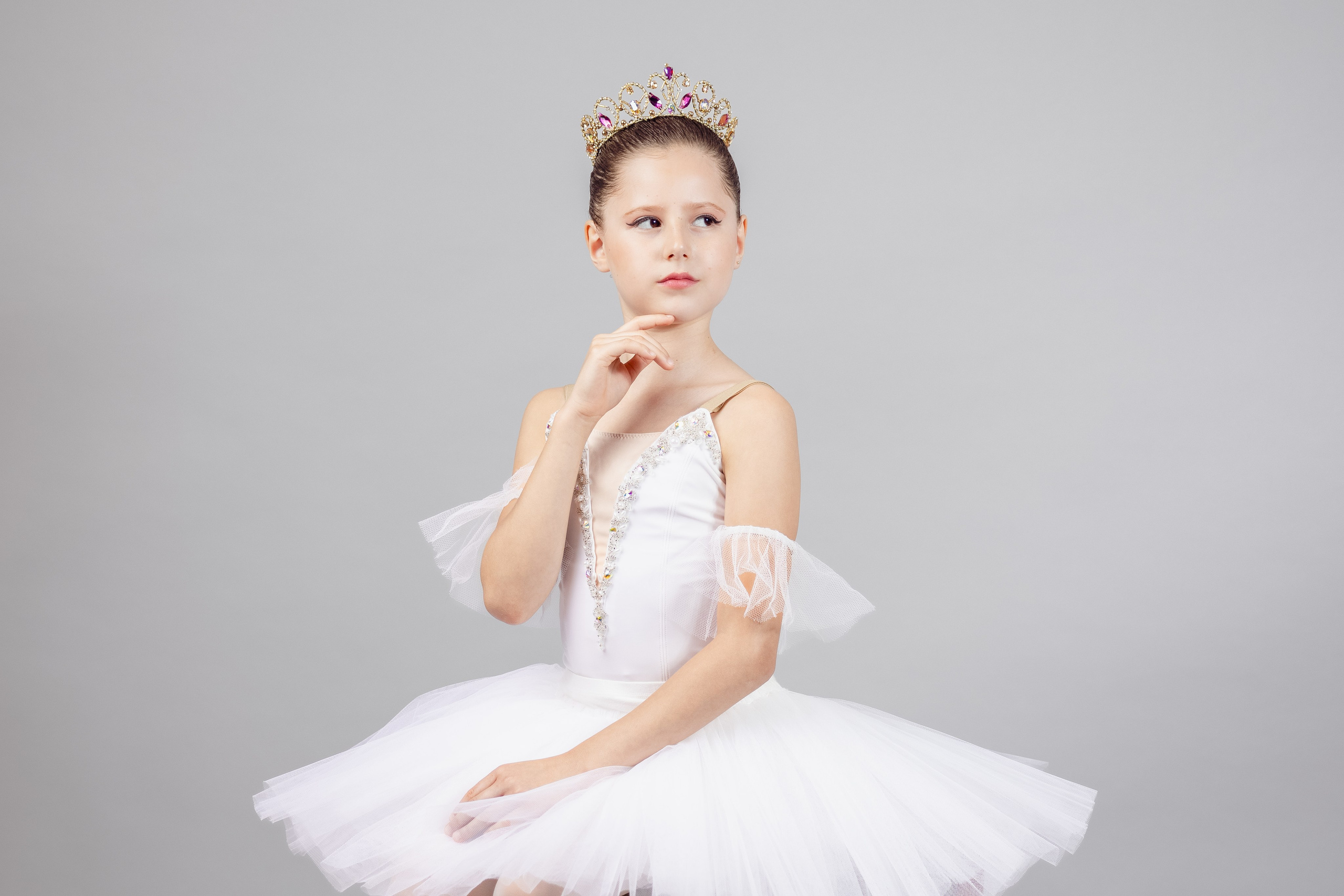 Young ballet student posing in studio