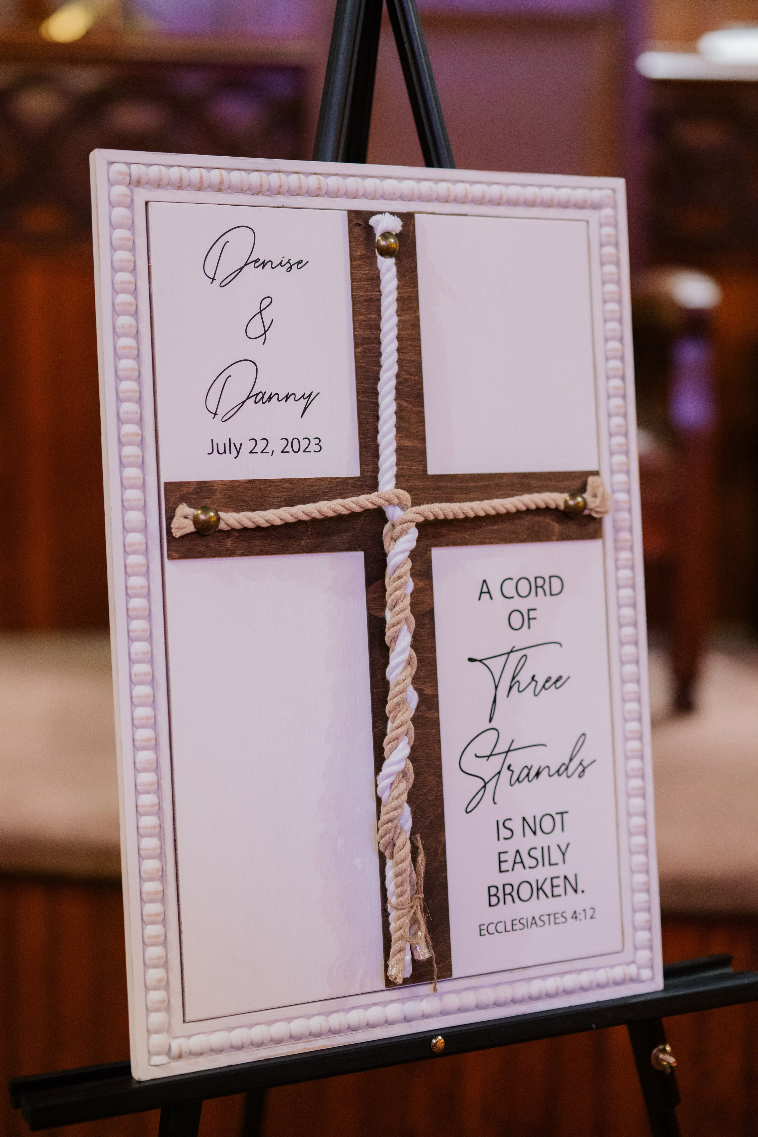 a cross on a sign with a rope