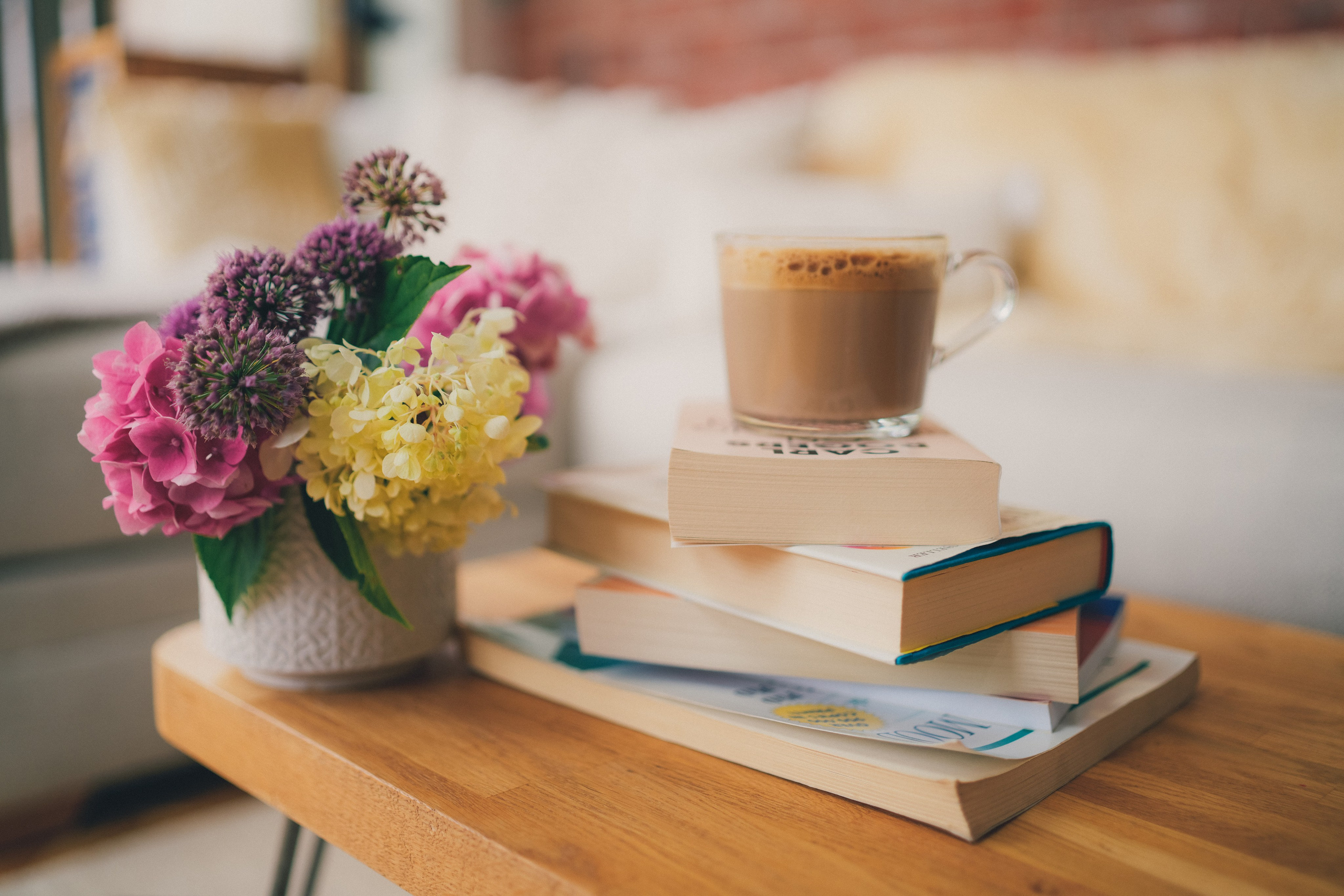 Brand storytelling still life photography with books and flowers in natural light