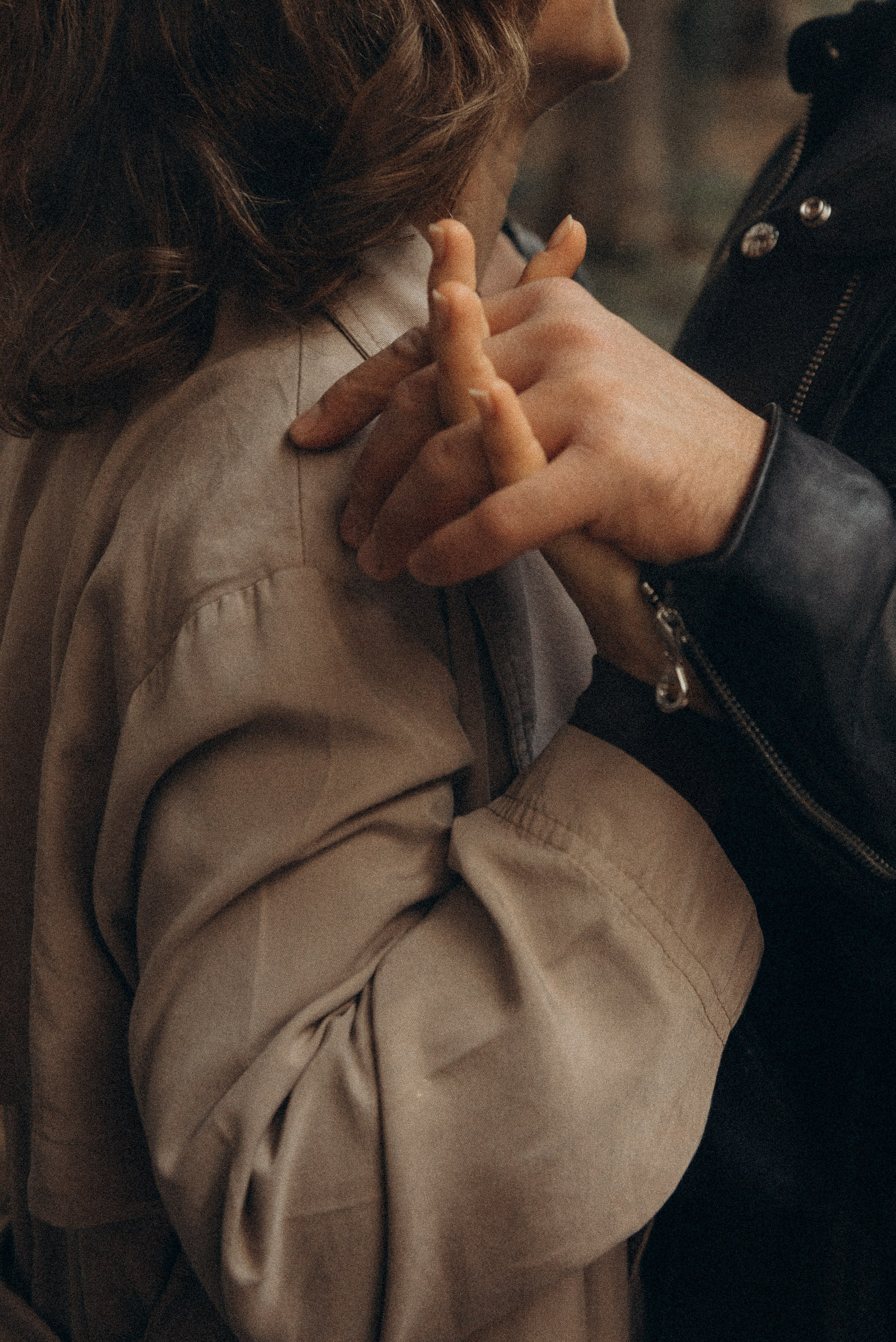 Engaged couple holding hands during a love story photoshoot in Milan’s historic center.