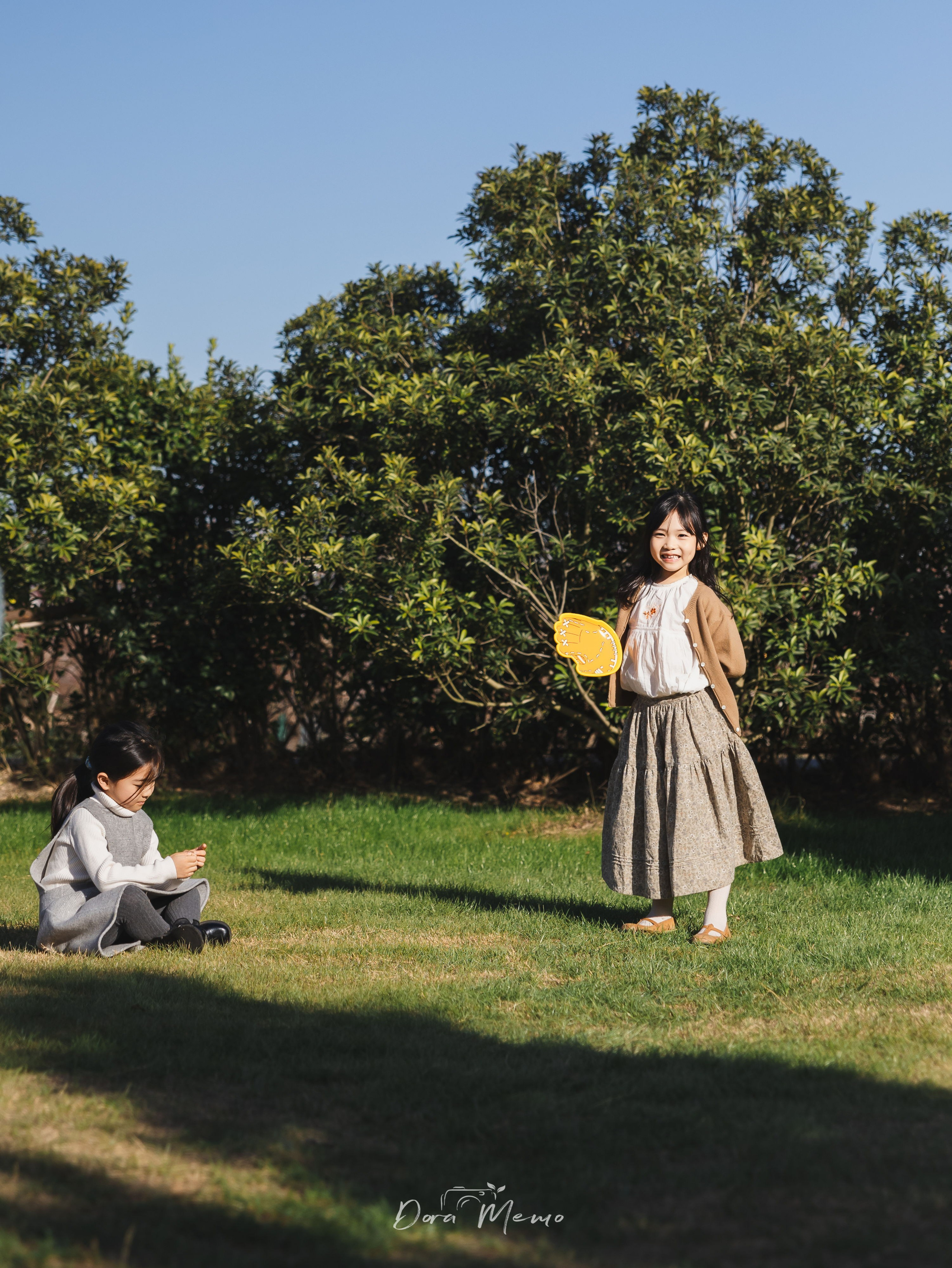 Shanghai family photography - birthday girl holding number 6 balloon in garden setting
