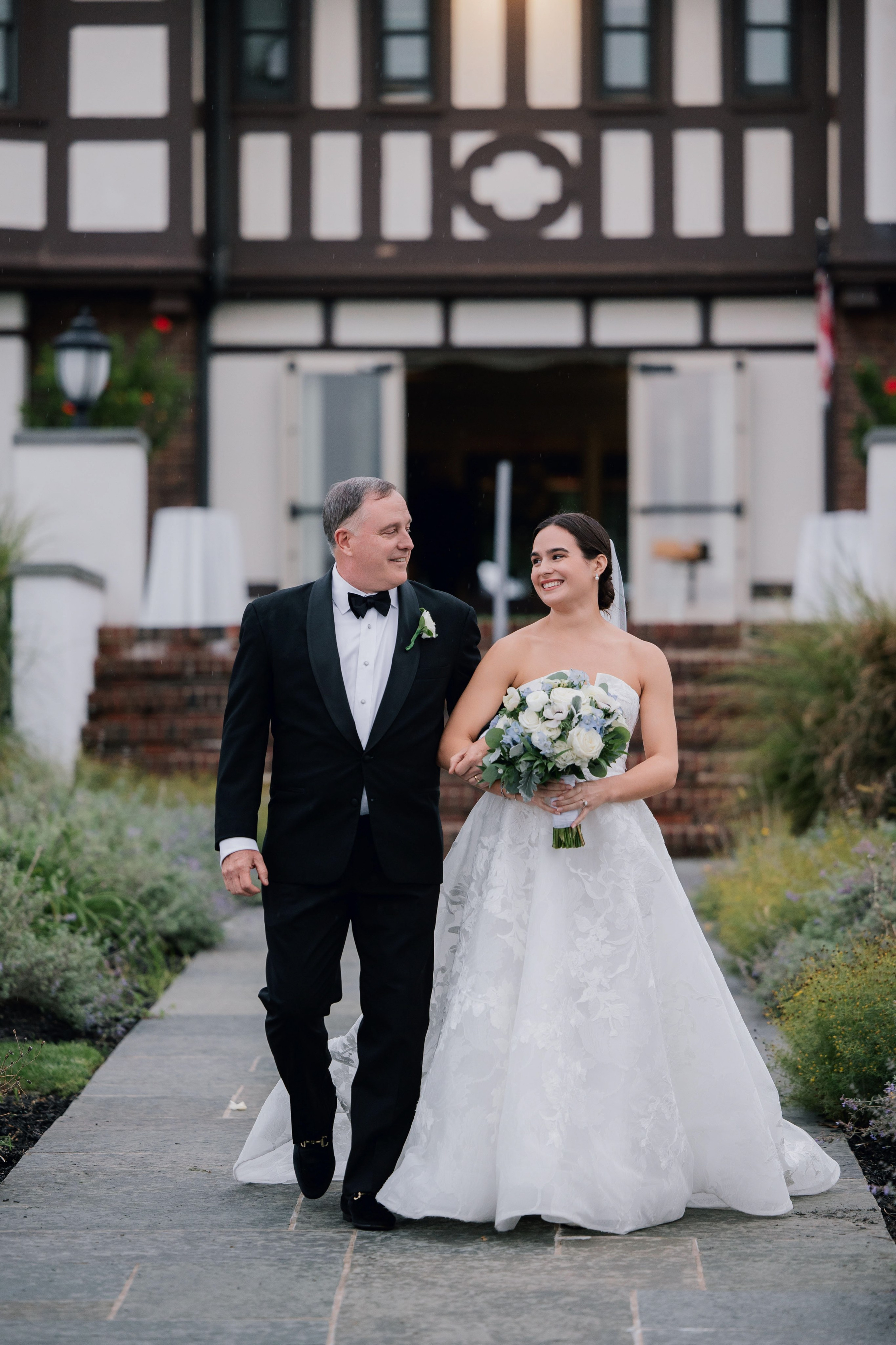 a bride and groom walking down the aisle