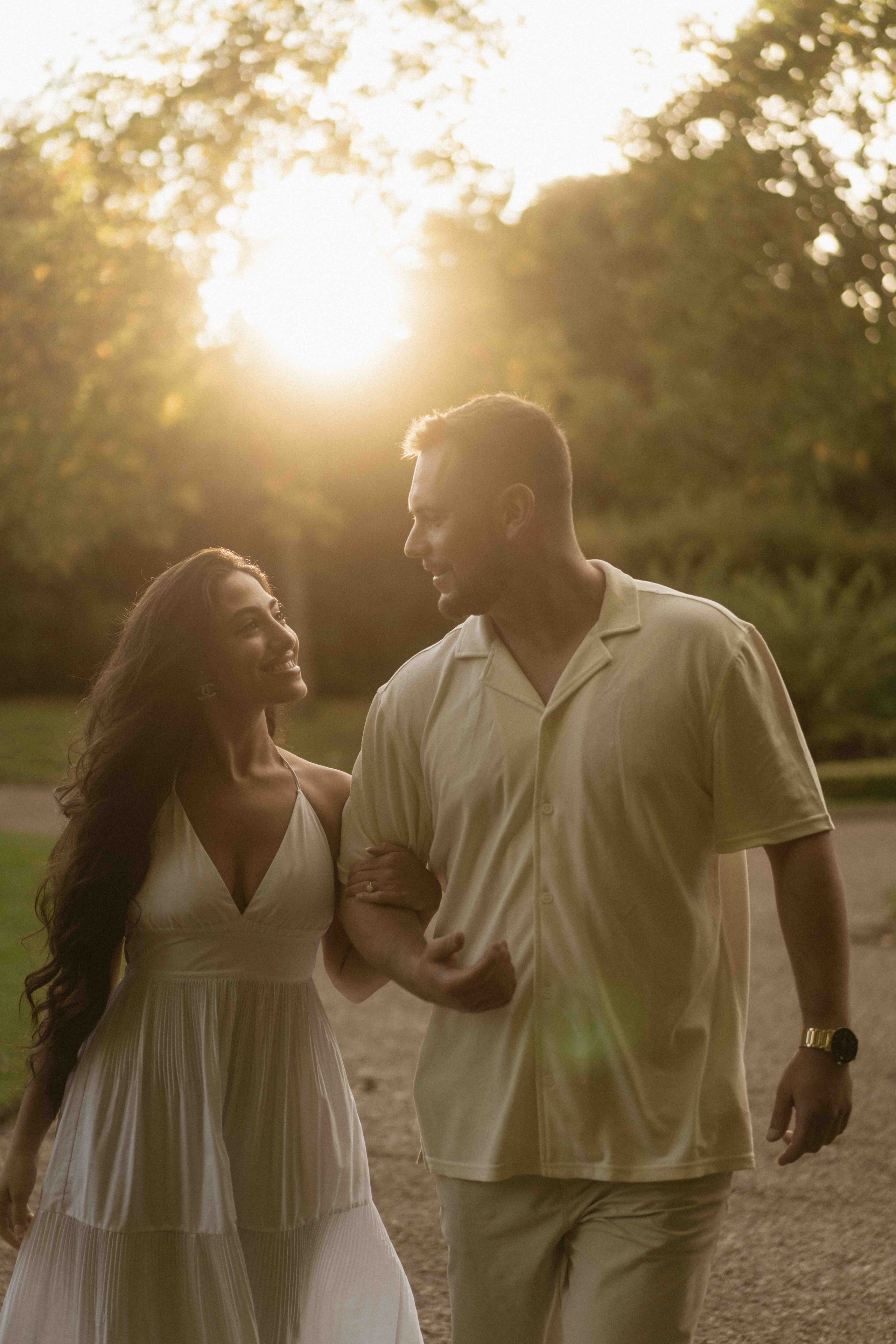 Couple walking together in Regent’s Park London after proposal, natural engagement photos