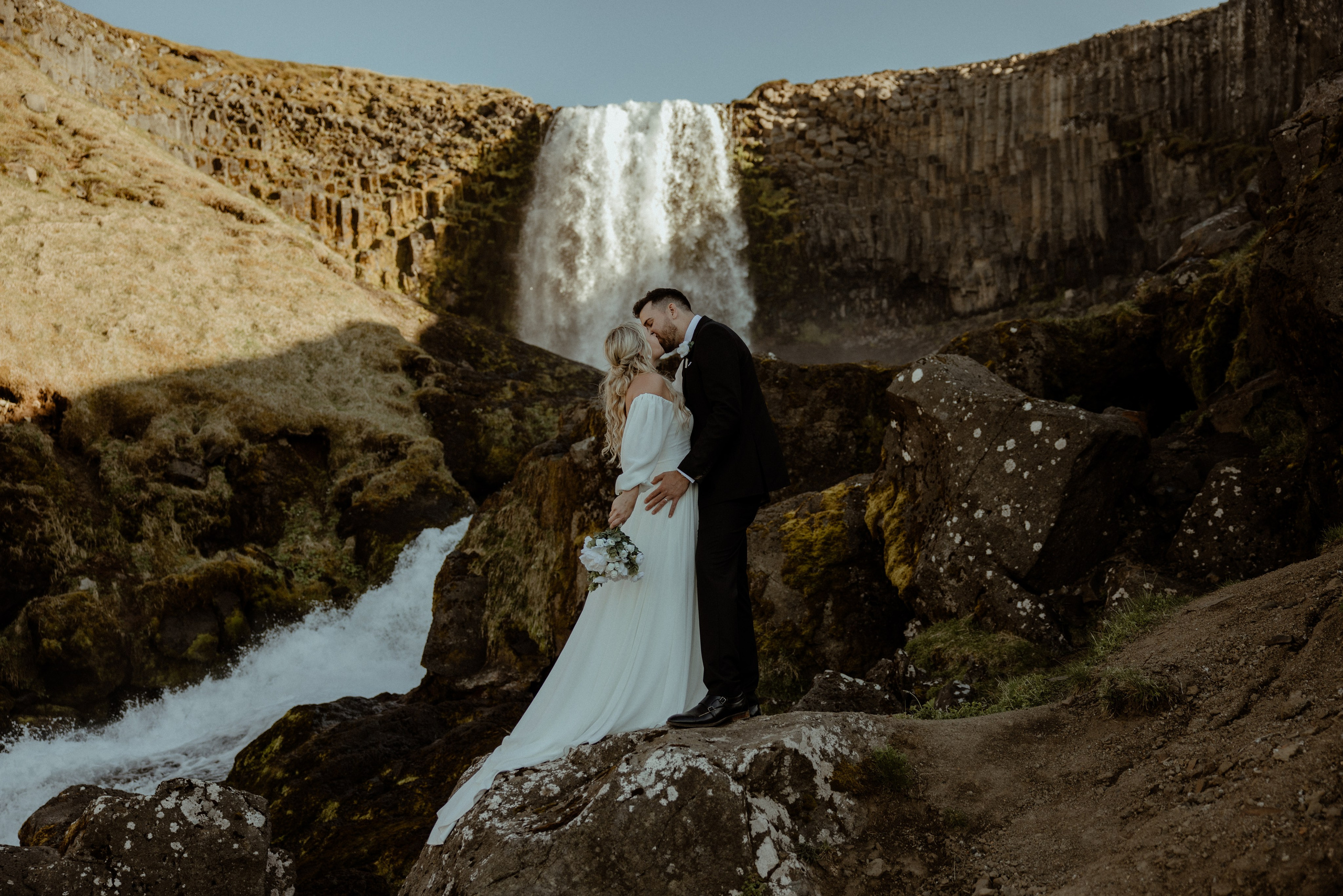Iceland elopement at Budir with midnight sun wedding photos at black sand beach. Iceland elopement photographer & videographer