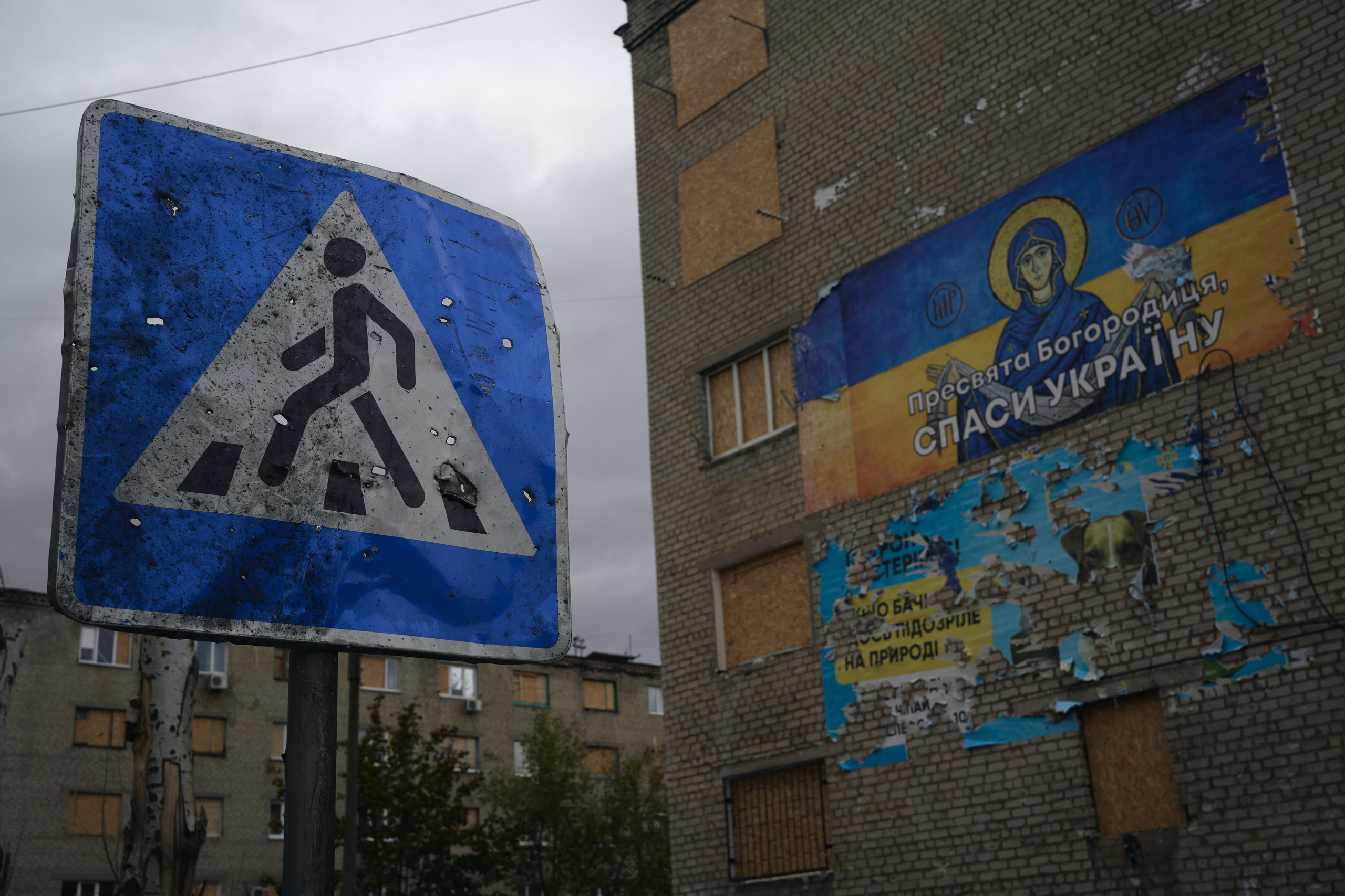 A road sign punctured by shapnels after rocket attack on the neighbourhood of Kurakhove town.