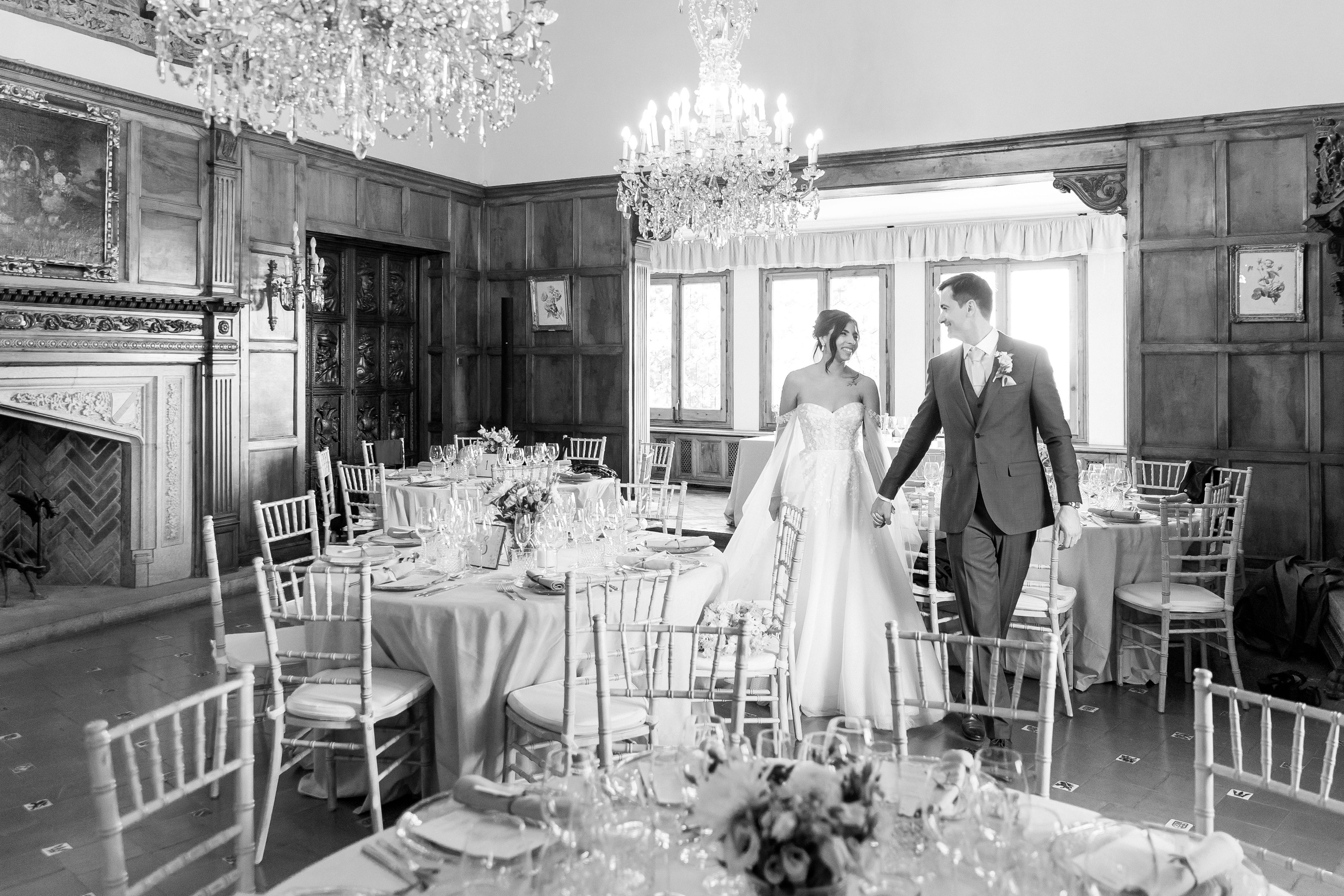 Artistic portrait of the bride and groom walking in the wedding venue in Spain.