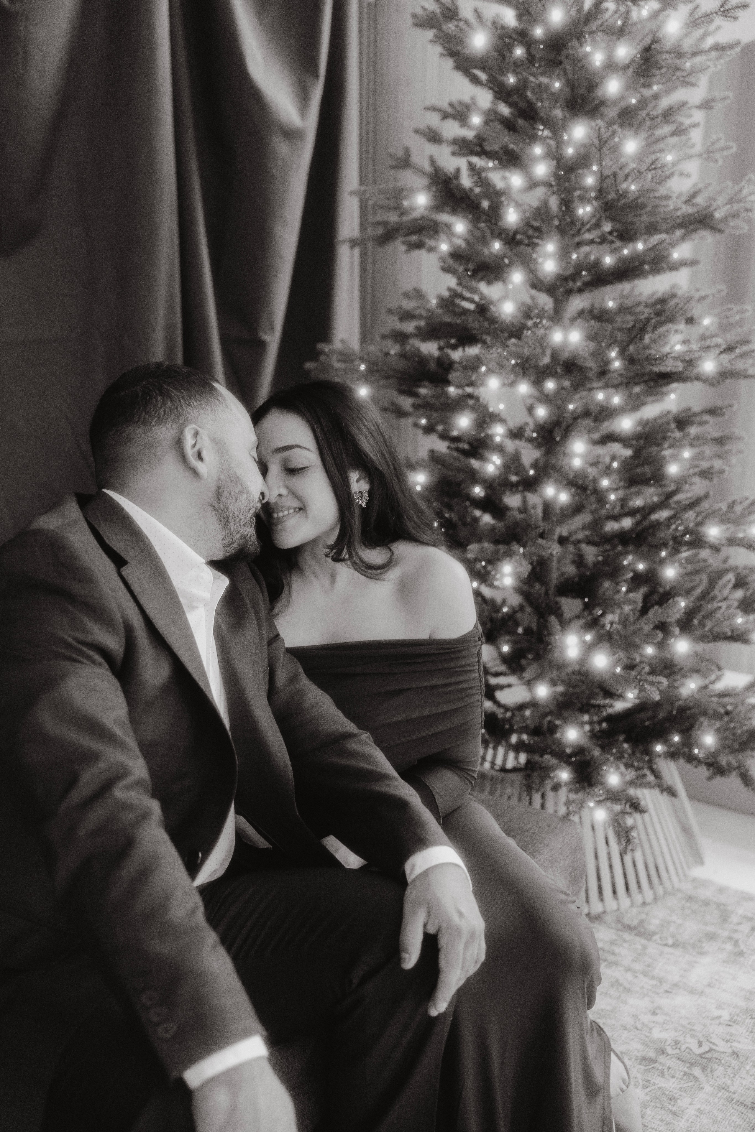 Family cuddling during Christmas photoshoot in downtown Chicago
