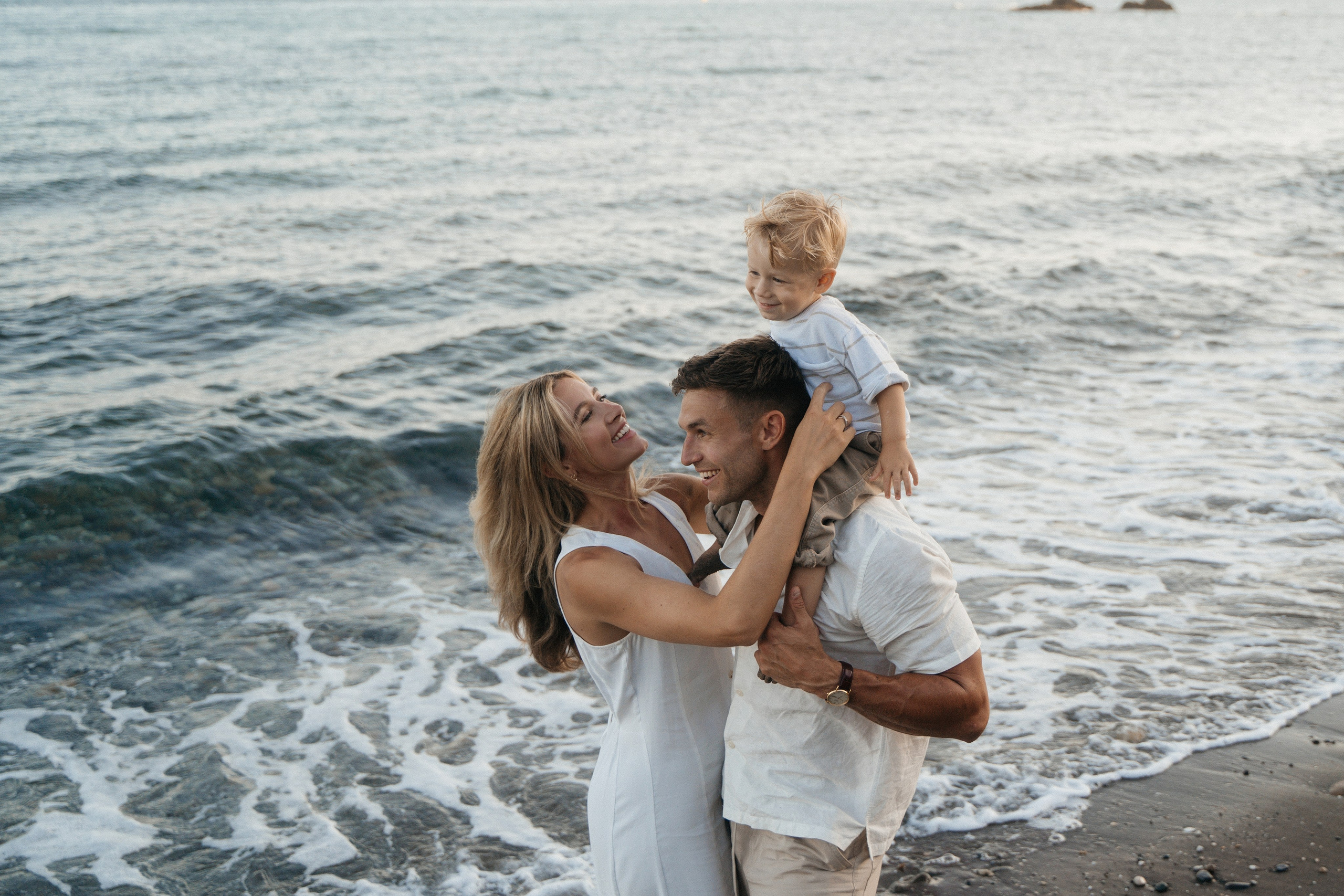 Smiling family with children captured in a beautiful beach
