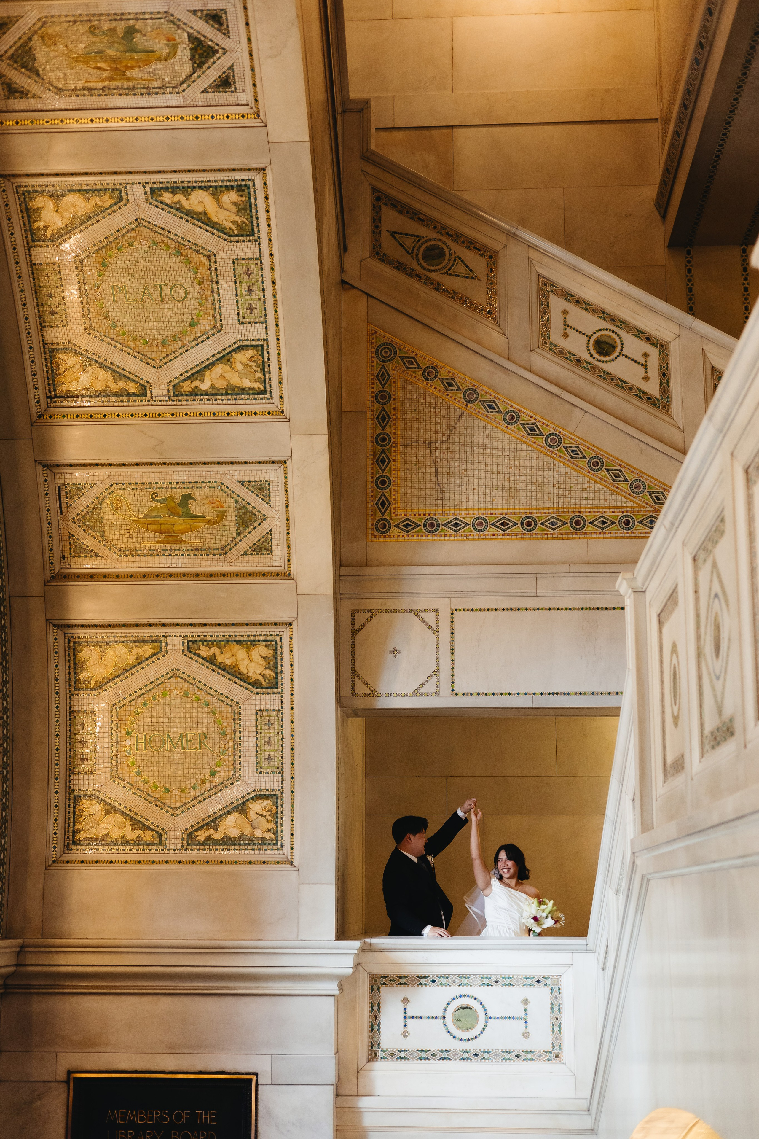 Wide shot of couple dancing inside the Chicago Cultural Center
