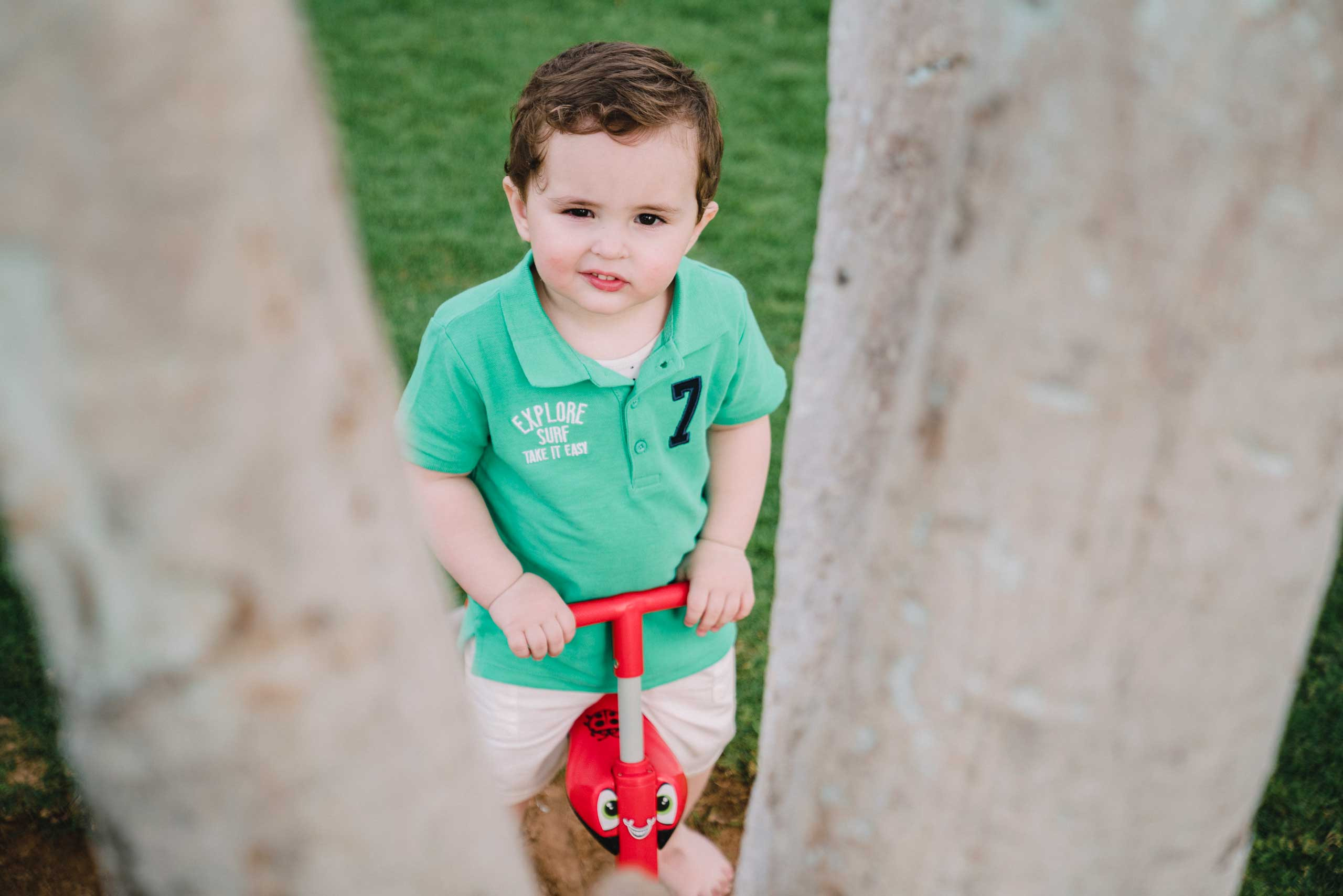 Funny looking boy and a bicycle