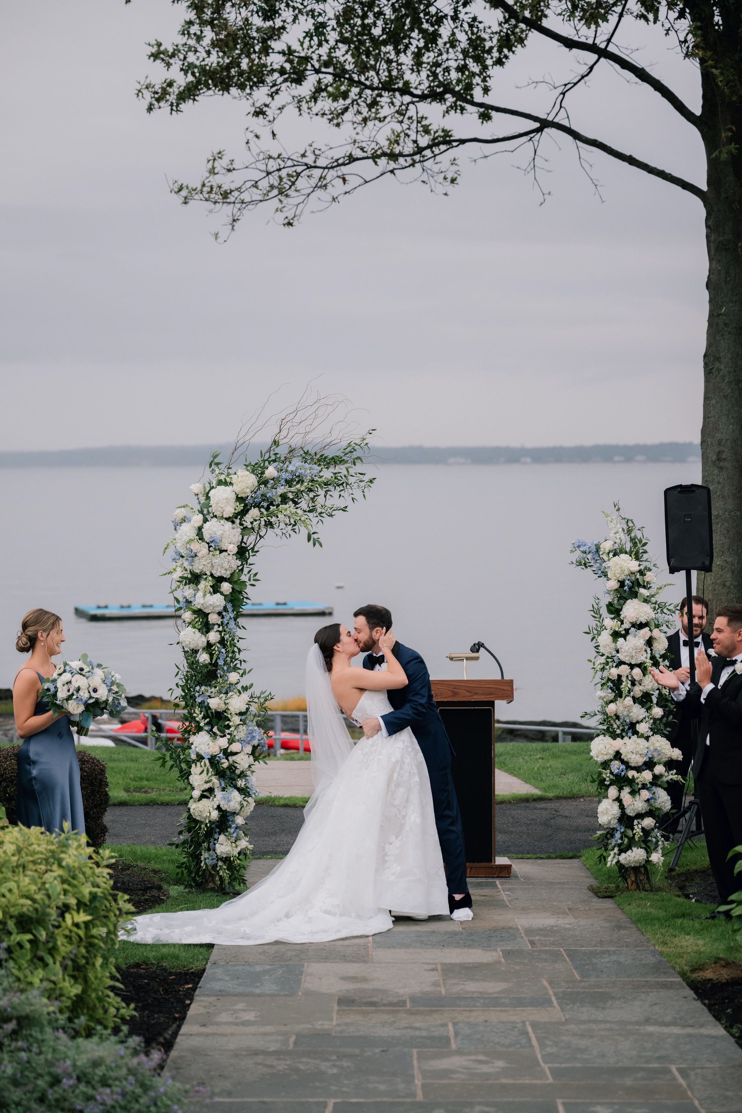 a bride and groom kiss at their wedding ceremony