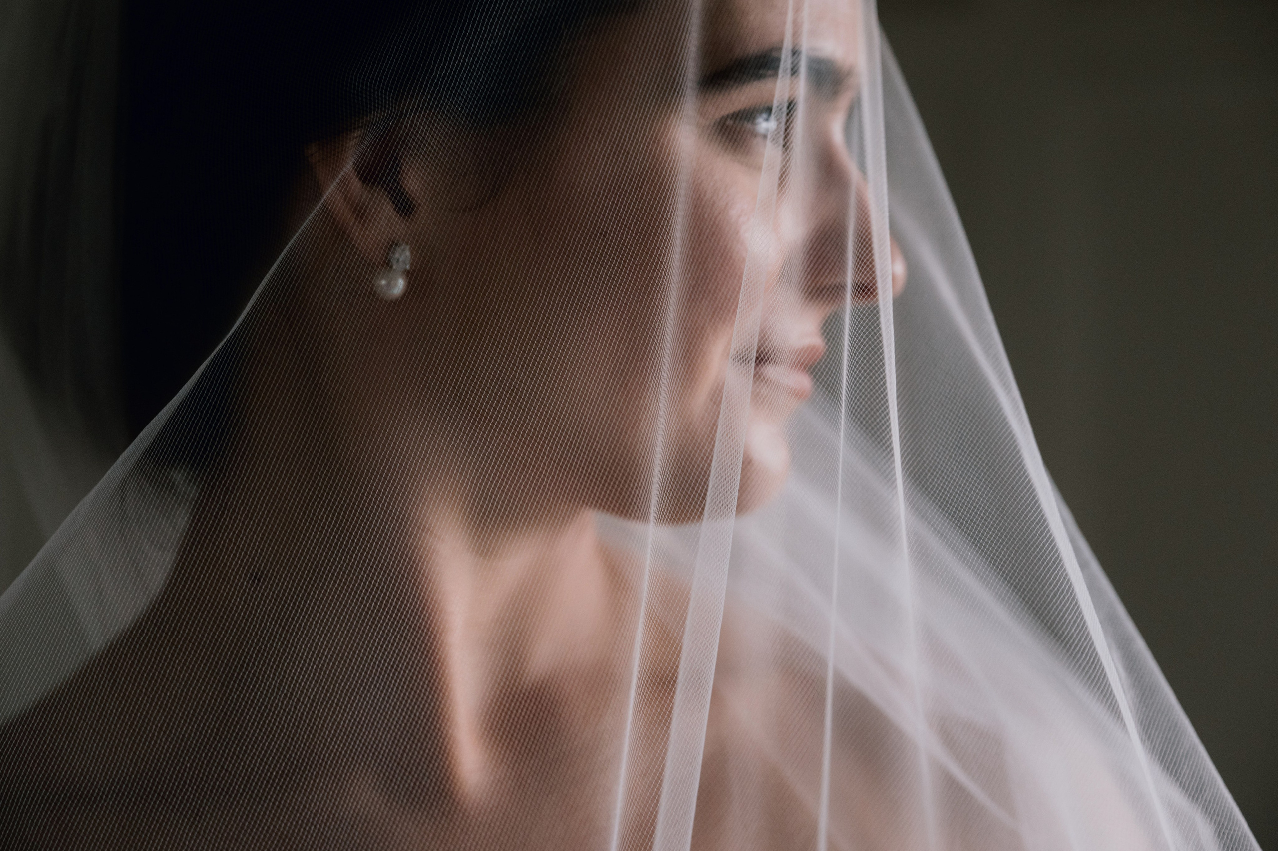 a woman wearing a veil and looking at the camera