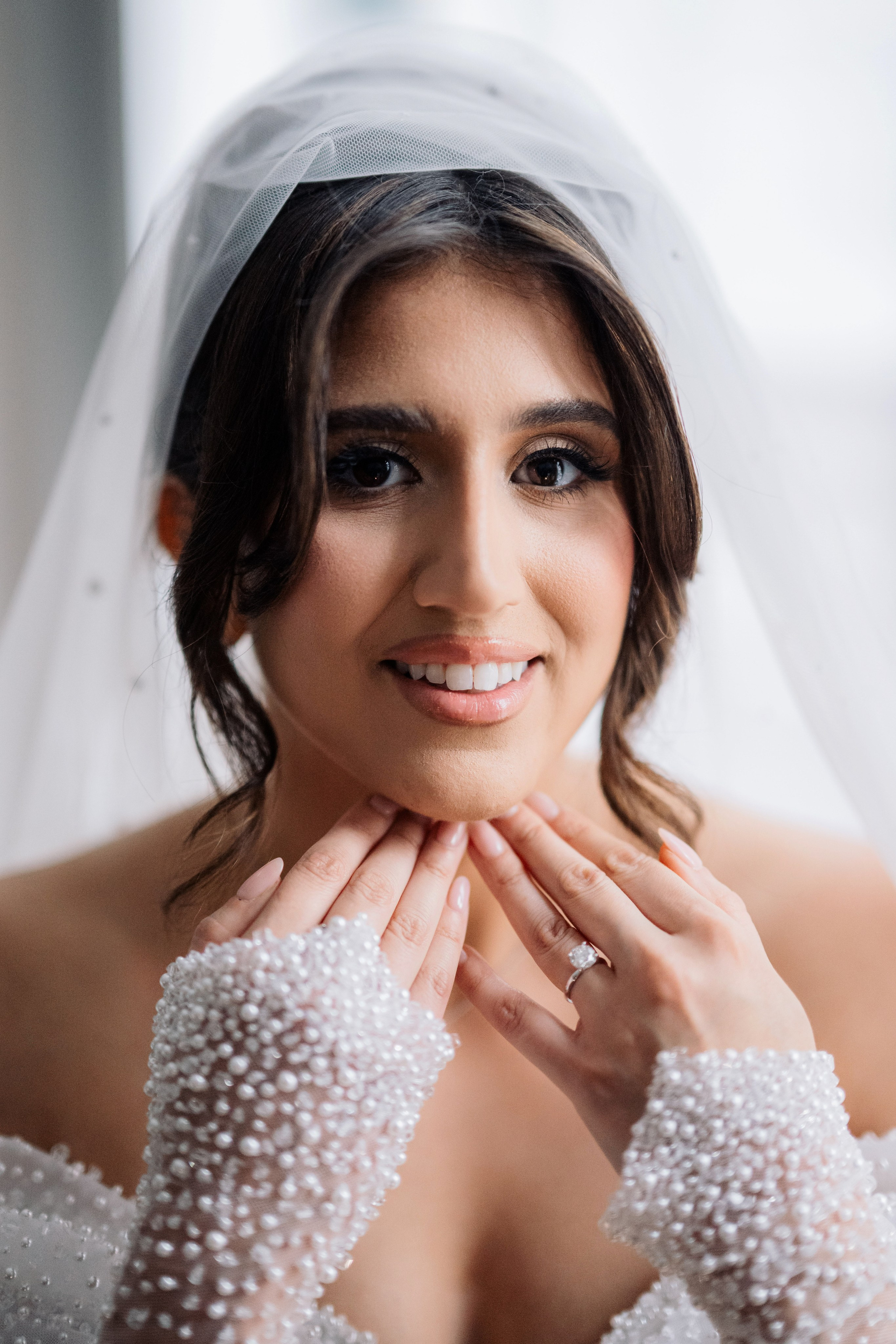 a bride in her wedding dress and veil