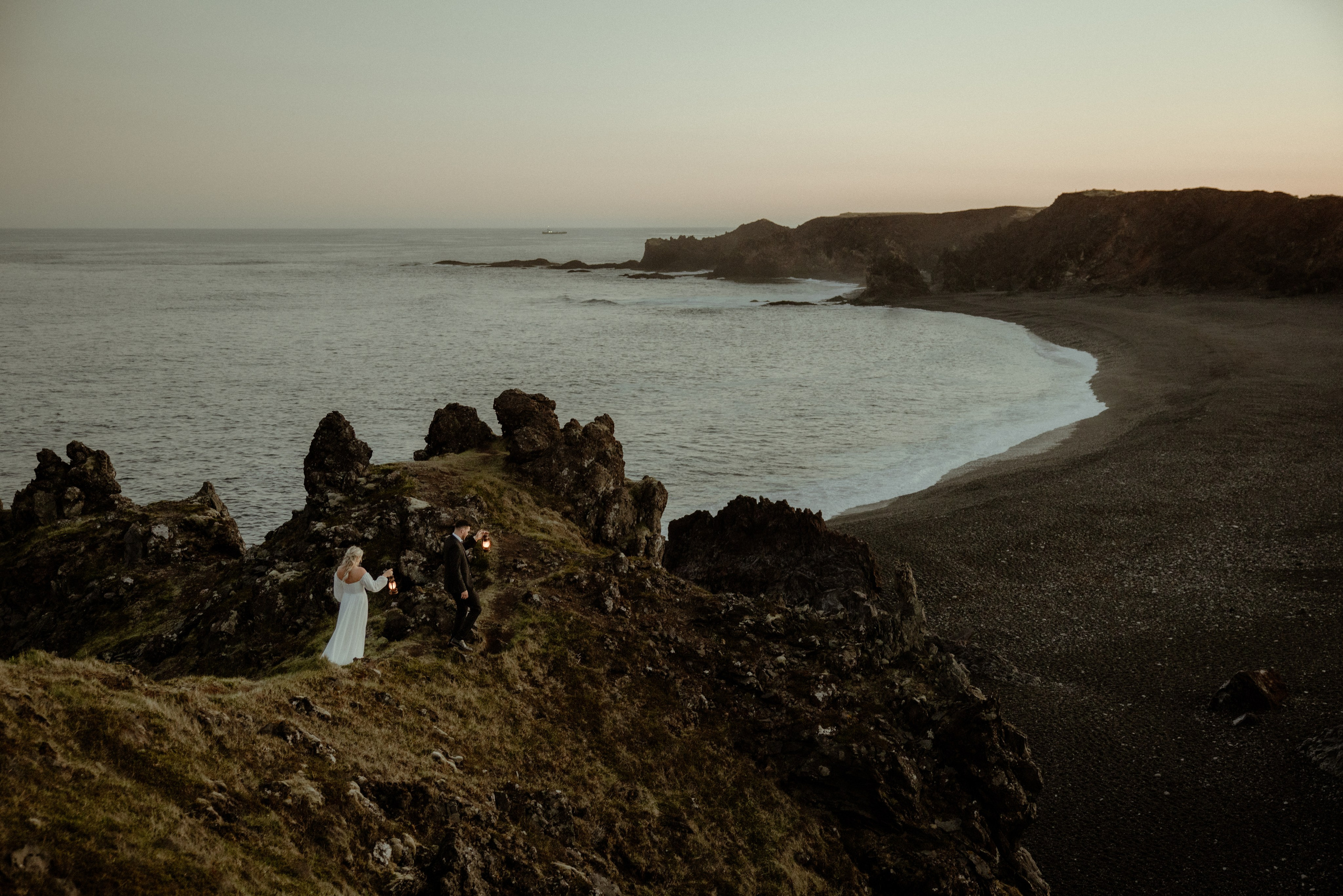 Iceland elopement at Budir with midnight sun wedding photos at black sand beach. Iceland elopement photographer & videographer