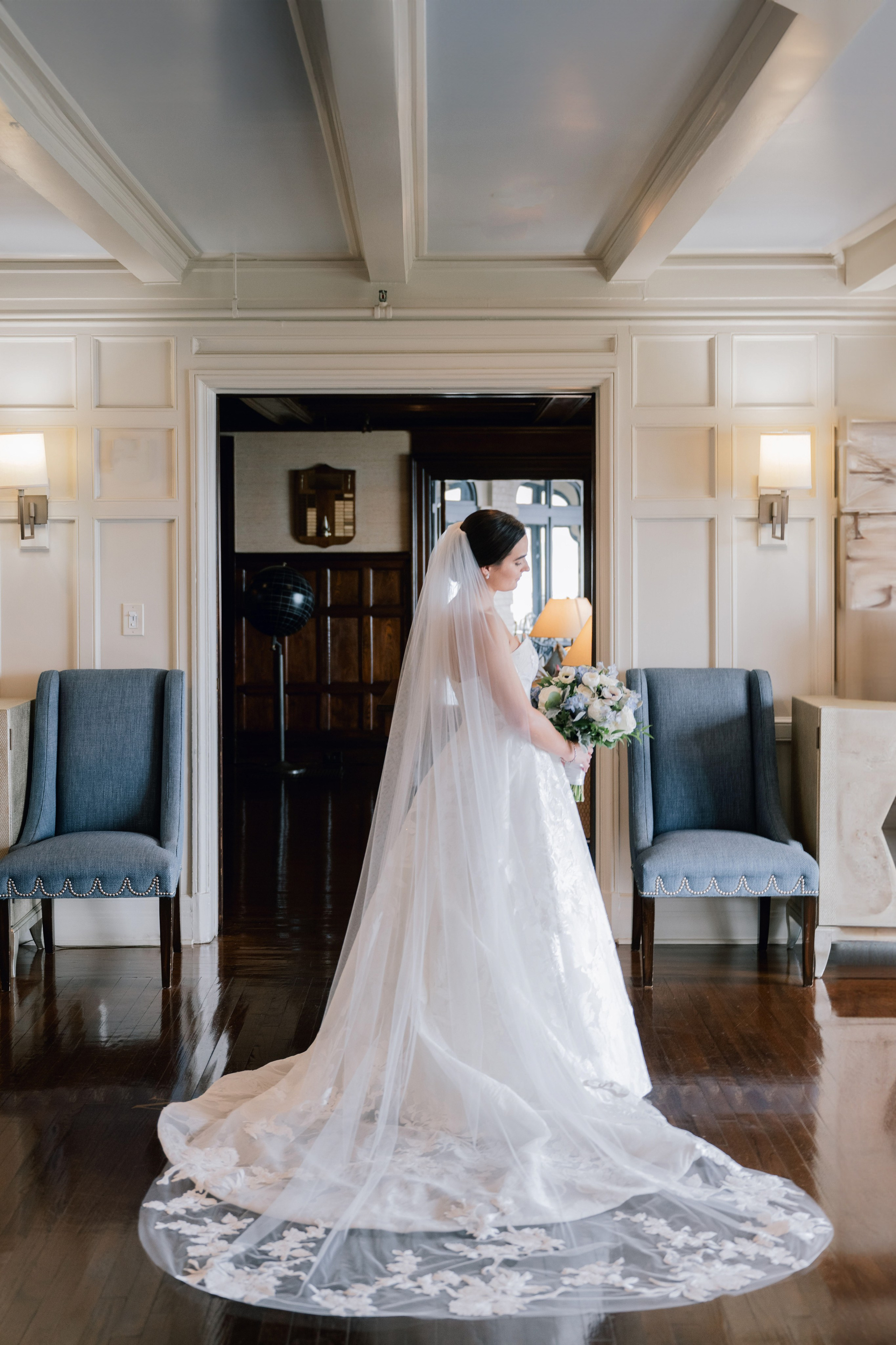 a bride in a wedding dress standing in a room