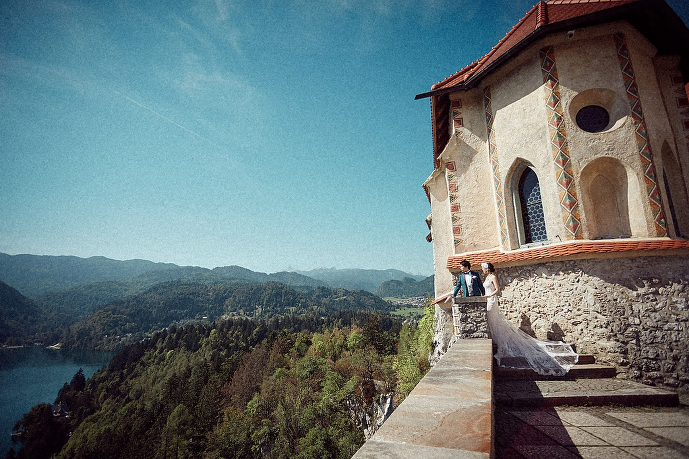 Couple enjoying Lake Bled views from Bled Castle.