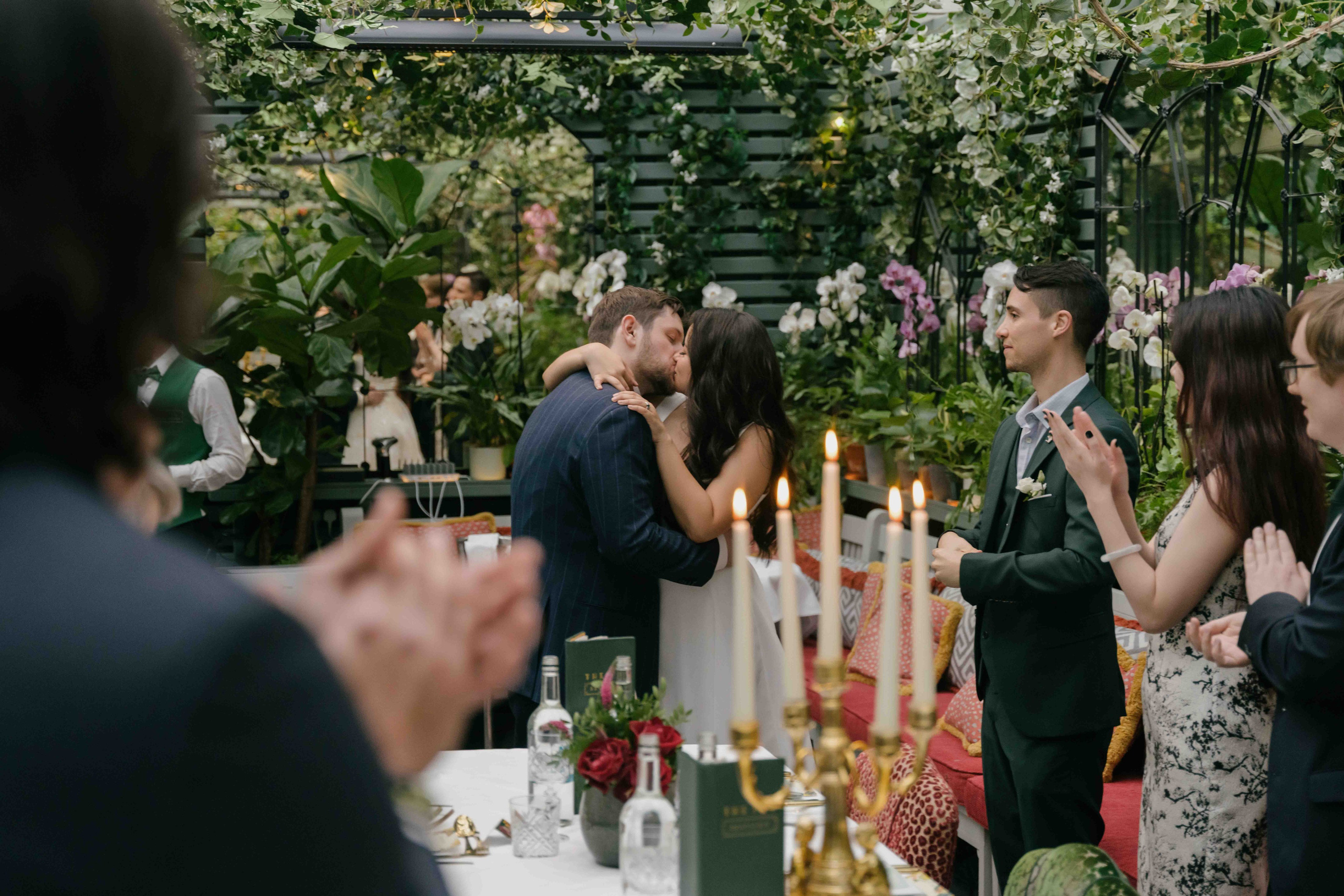 Wedding reception at The Ivy London, elegant floral interior, intimate dinner with family