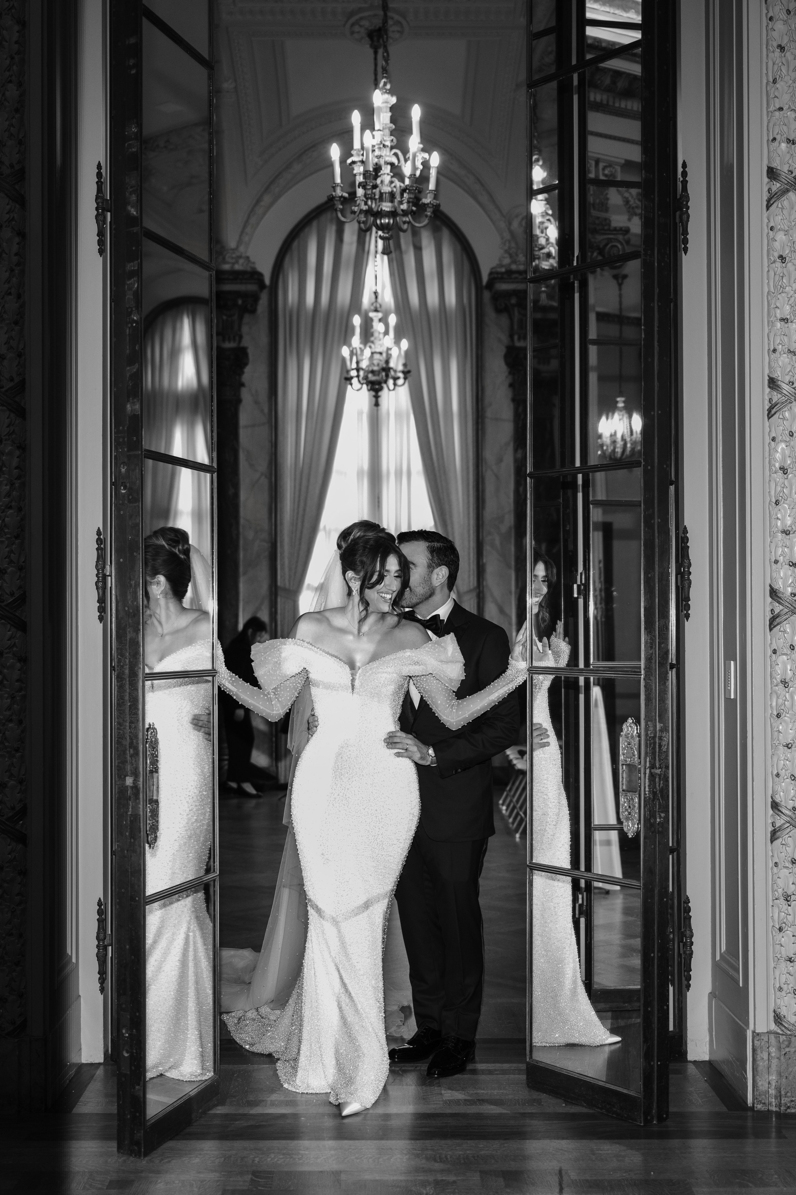 a bride and groom are standing in the doorway of their wedding venue