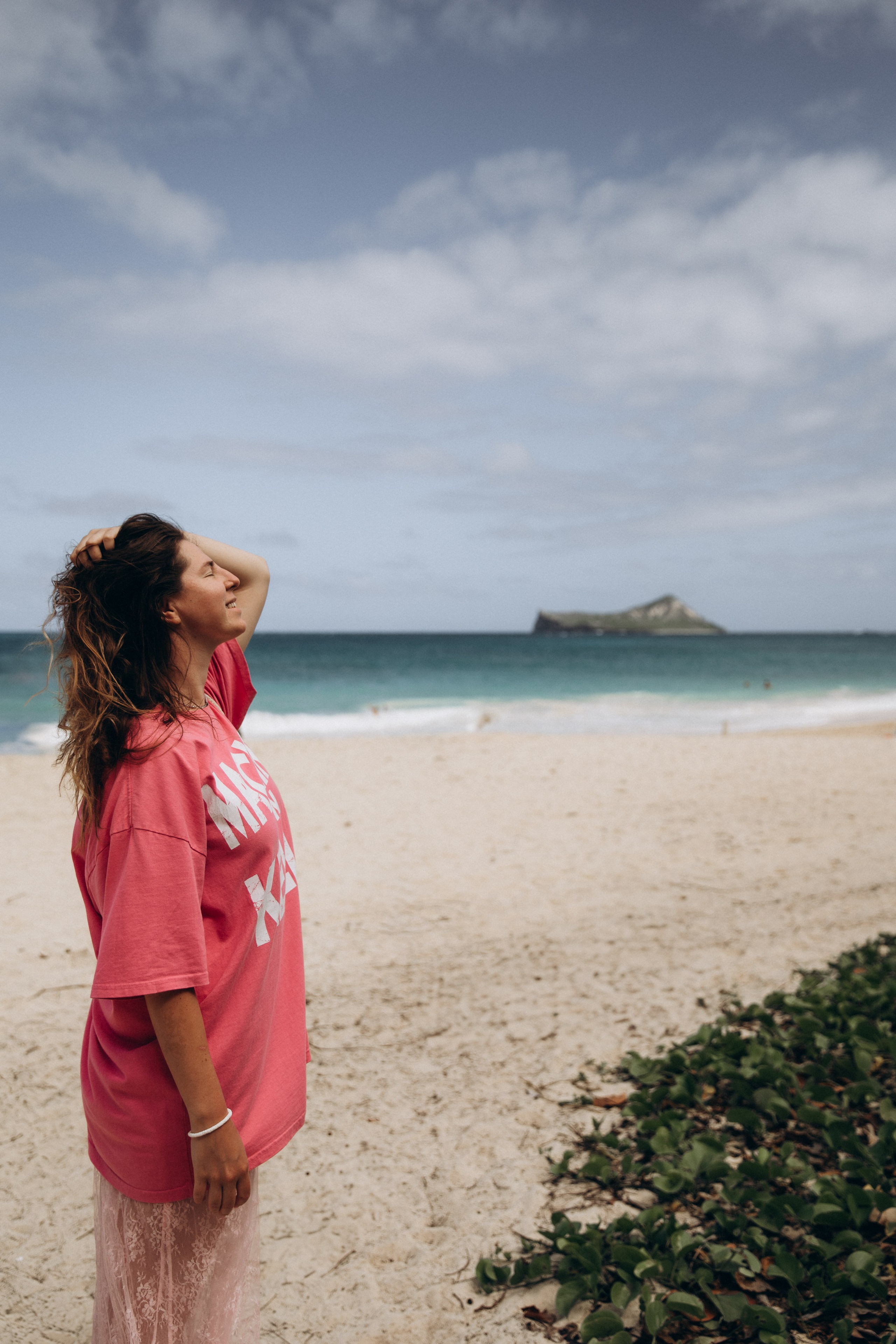 A girl enjoying the view at Waimanalo Beach, Oahu