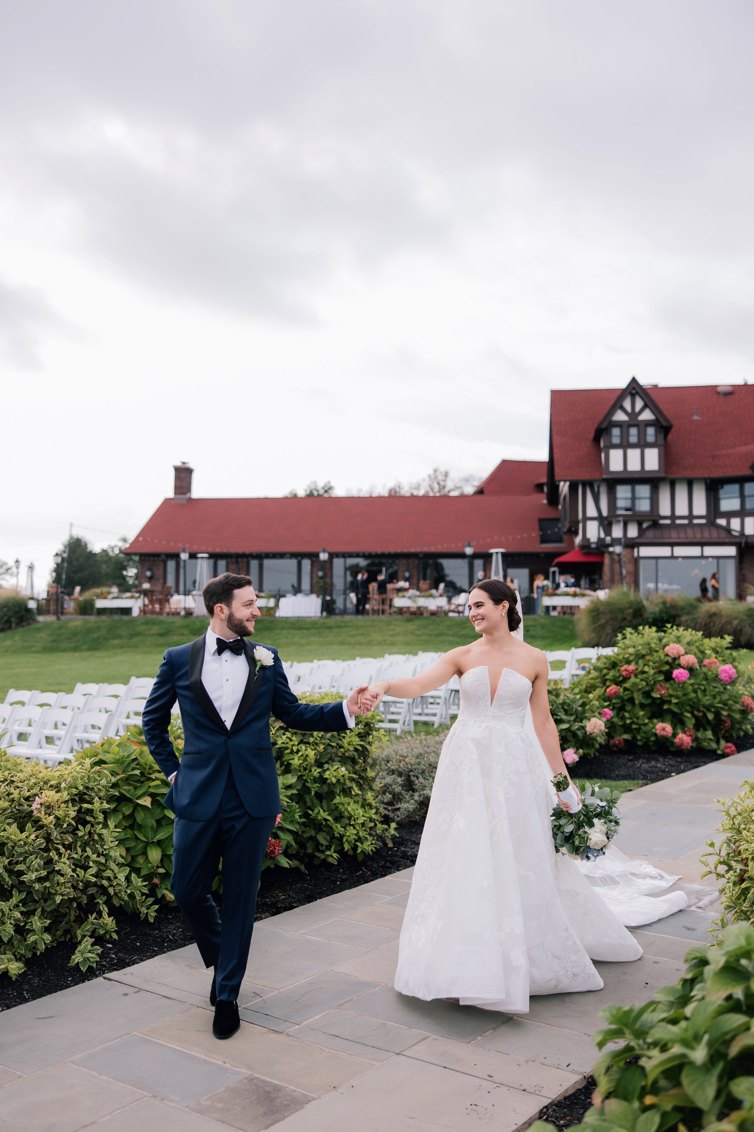 a bride and groom walking down the aisle