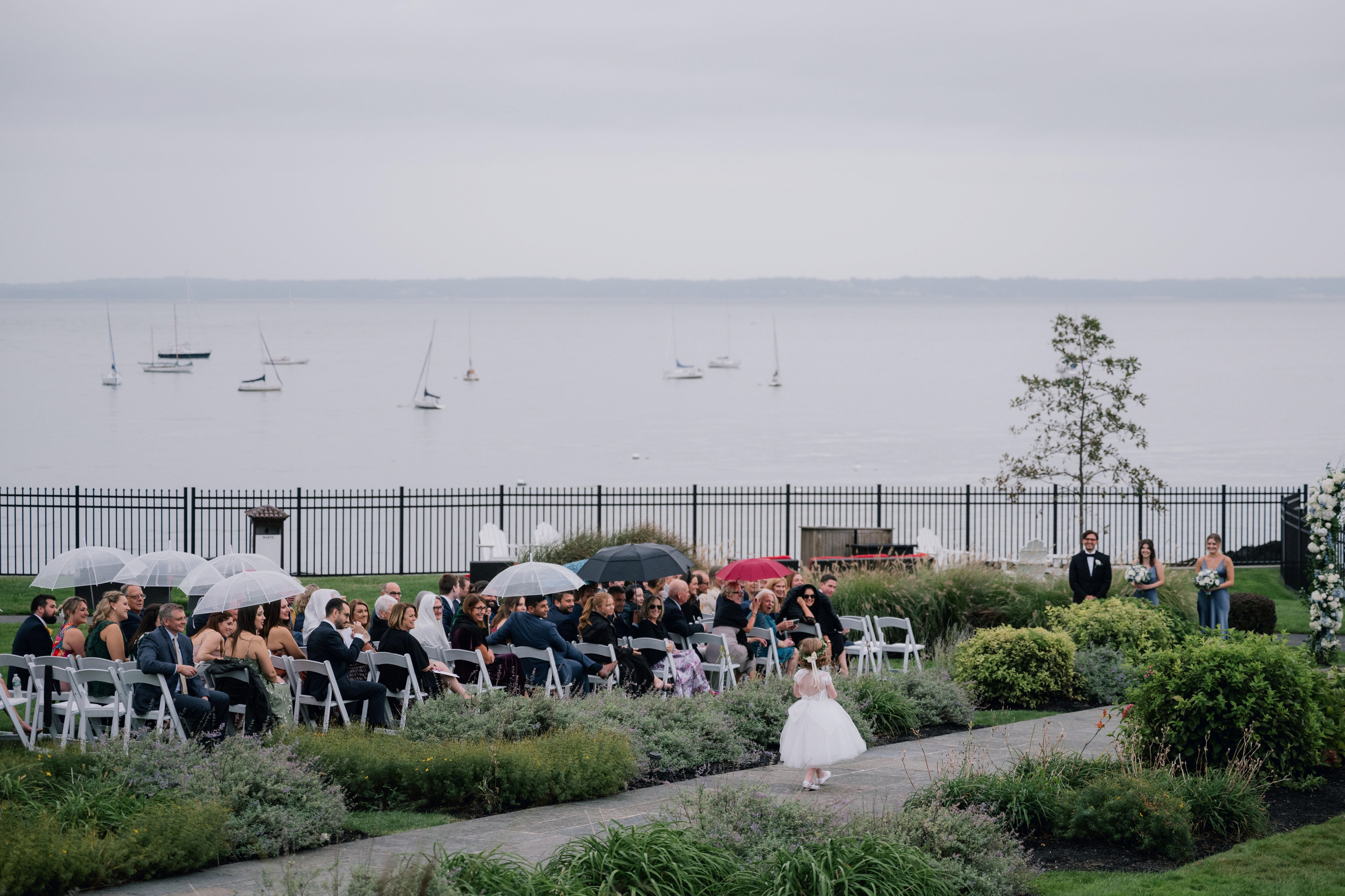 a wedding ceremony on the waterfront with a view of the water
