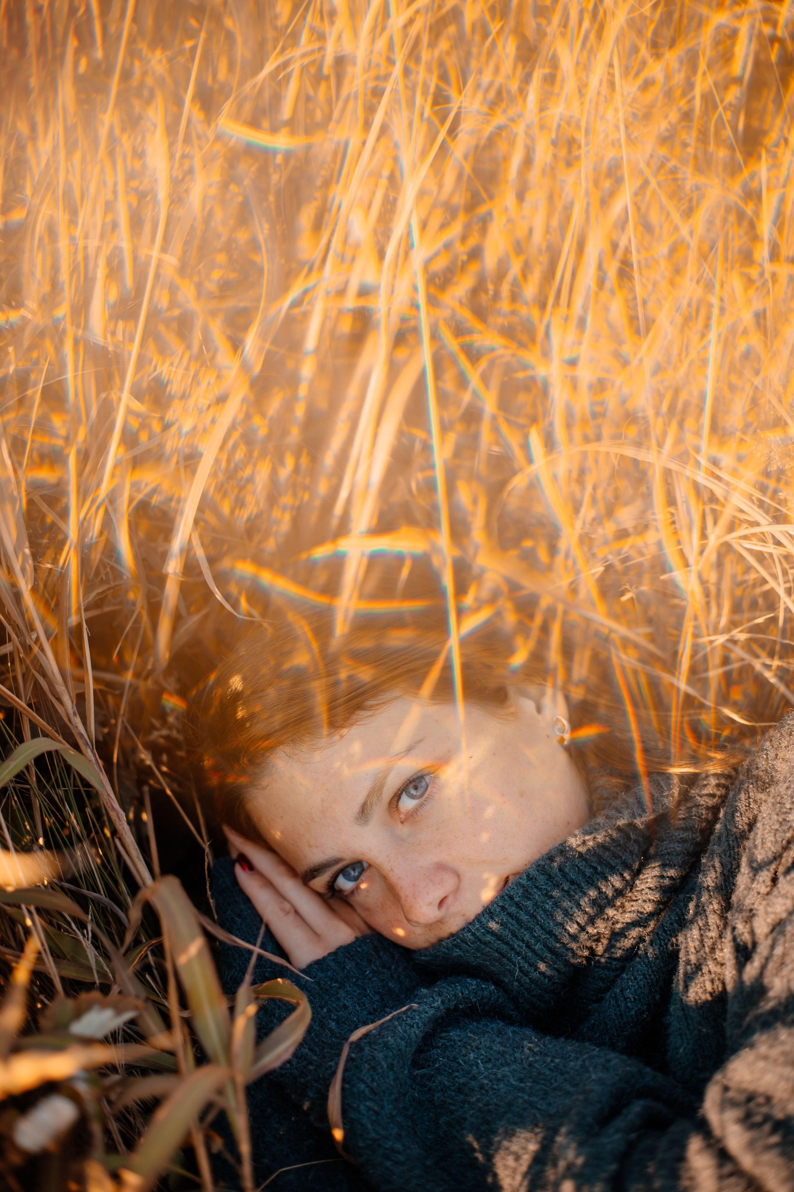 Artistic portrait of a woman with soft lens flare