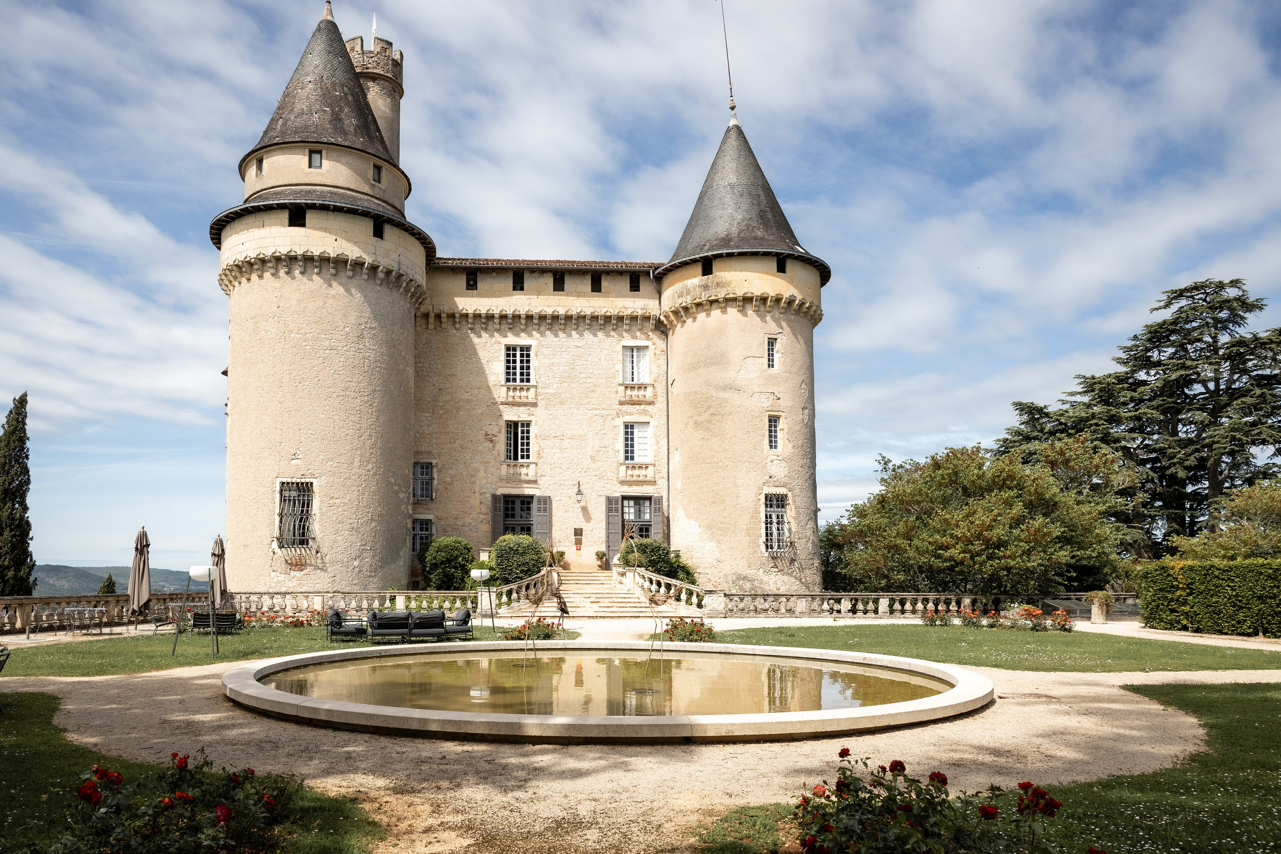 Château Mercuès exterior with hilltop towers above the Lot valley