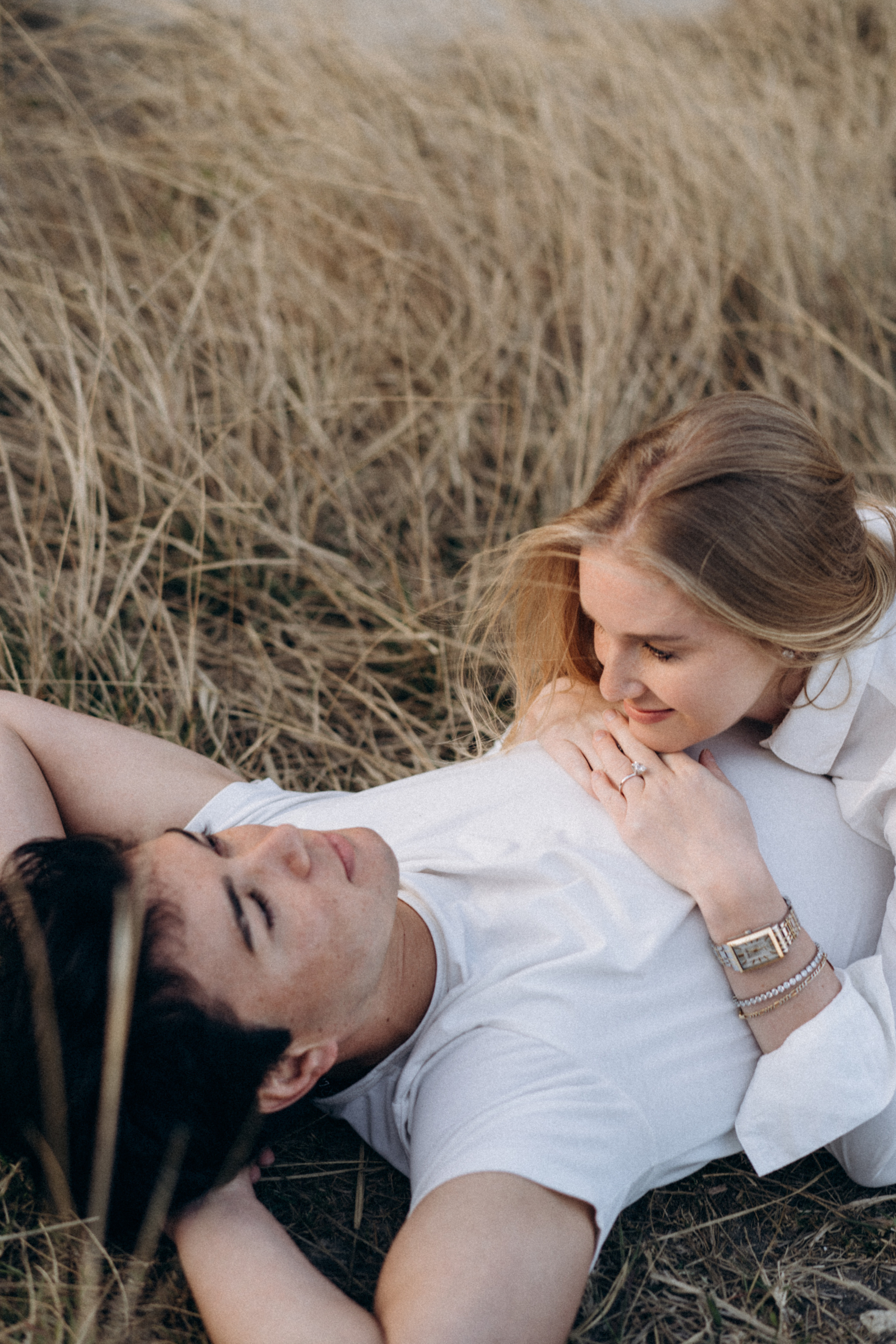 Golden Hour Romance: Hong Kong Mountain Field Engagement. Evgeniia Pavlova Photography