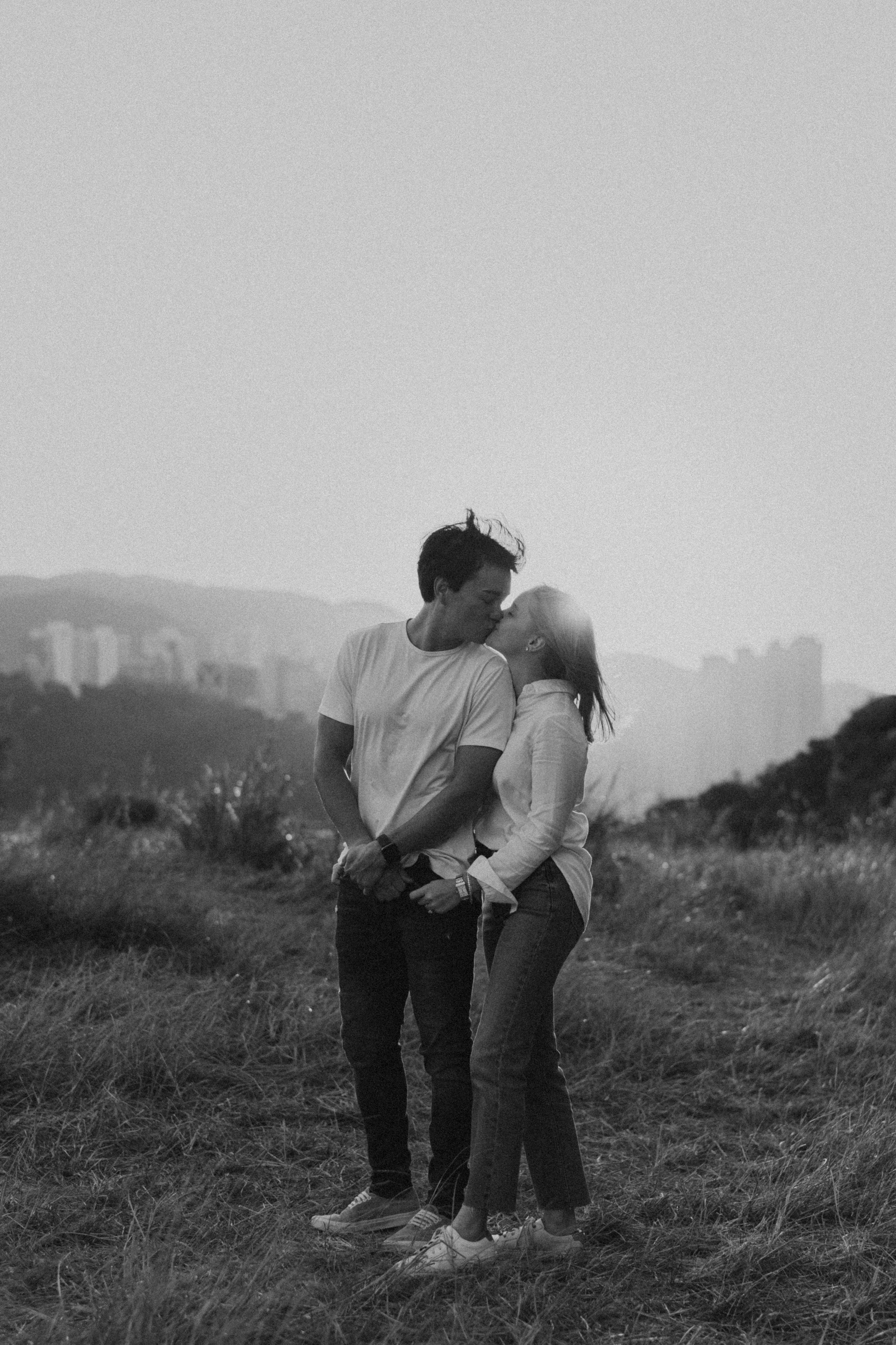 Golden Hour Romance: Hong Kong Mountain Field Engagement. Evgeniia Pavlova Photography