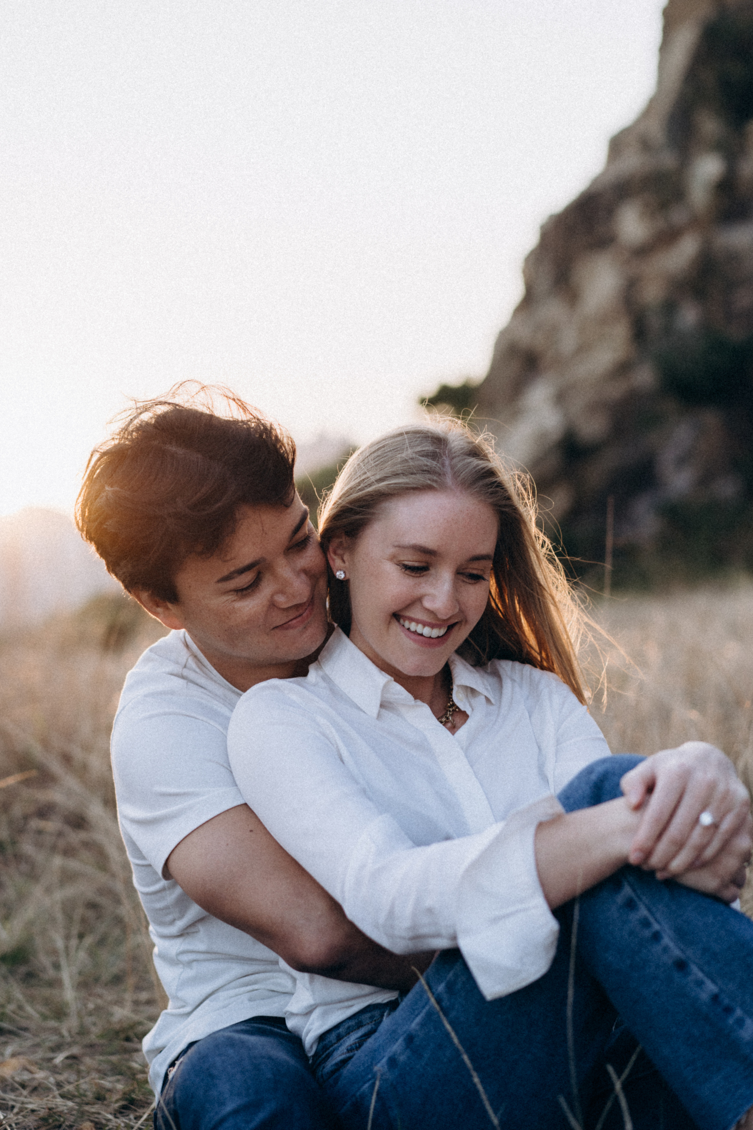 Golden Hour Romance: Hong Kong Mountain Field Engagement. Evgeniia Pavlova Photography