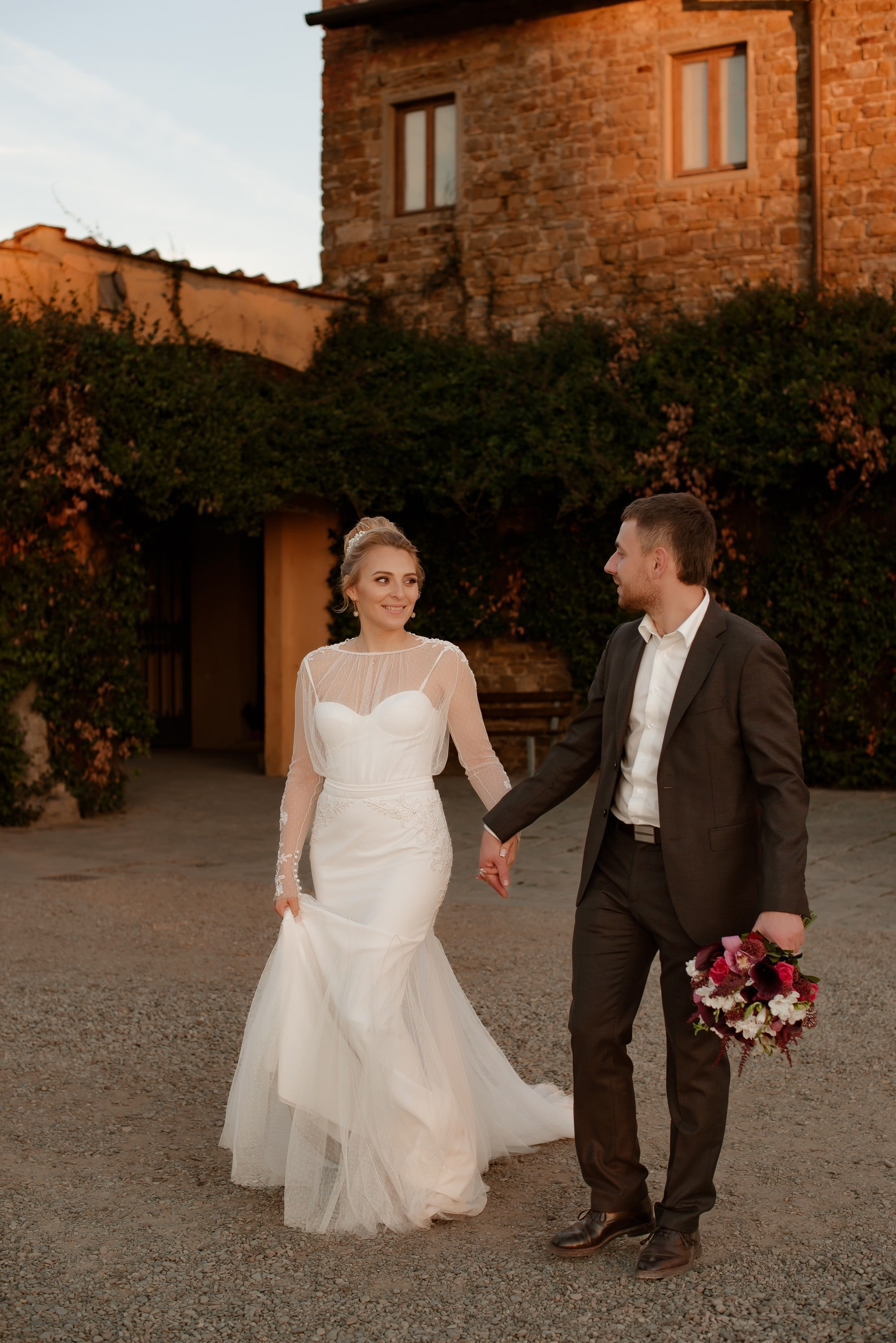 Newlyweds portrait in historic streets of Florence Italy