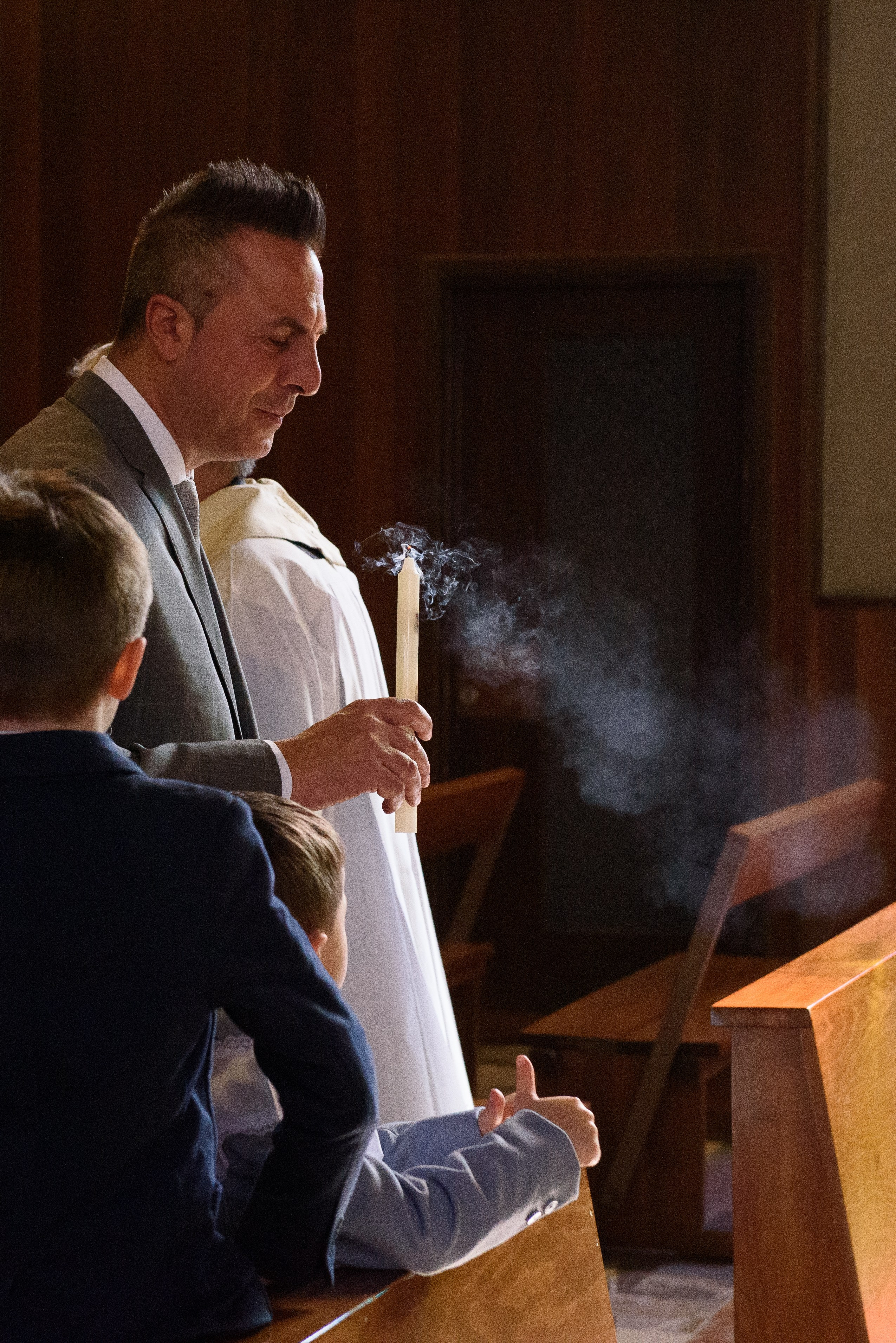 Baptism of a child in Milan with a photographer