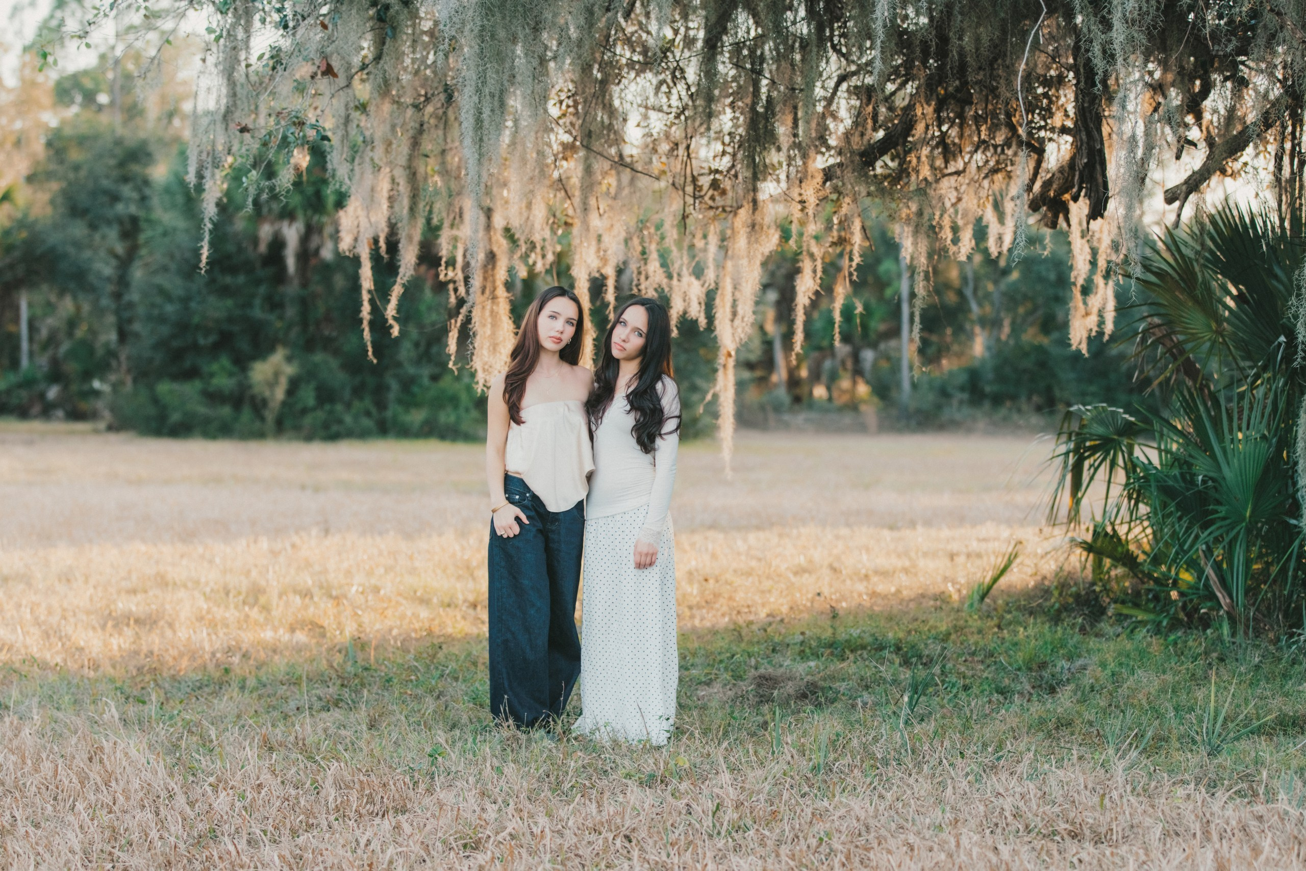 Sister posing under the trees family portrait Northport Florida