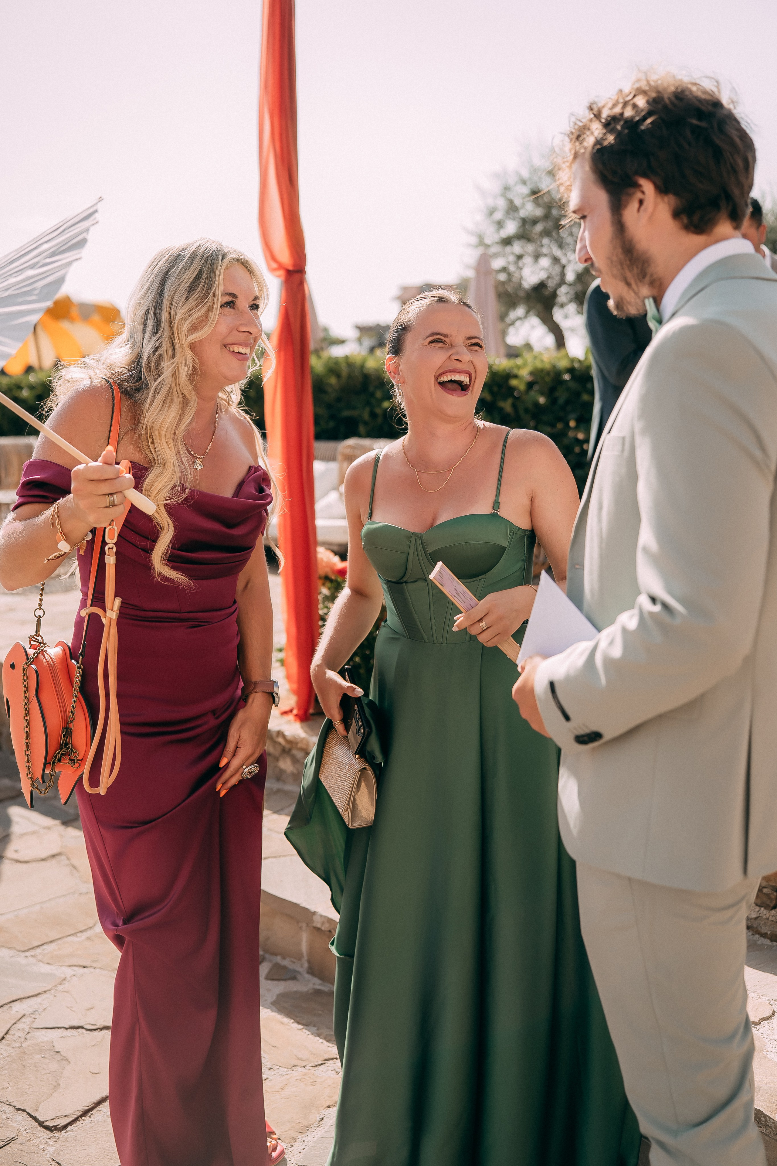 Guests laughing together during the welcome drinks at the castle