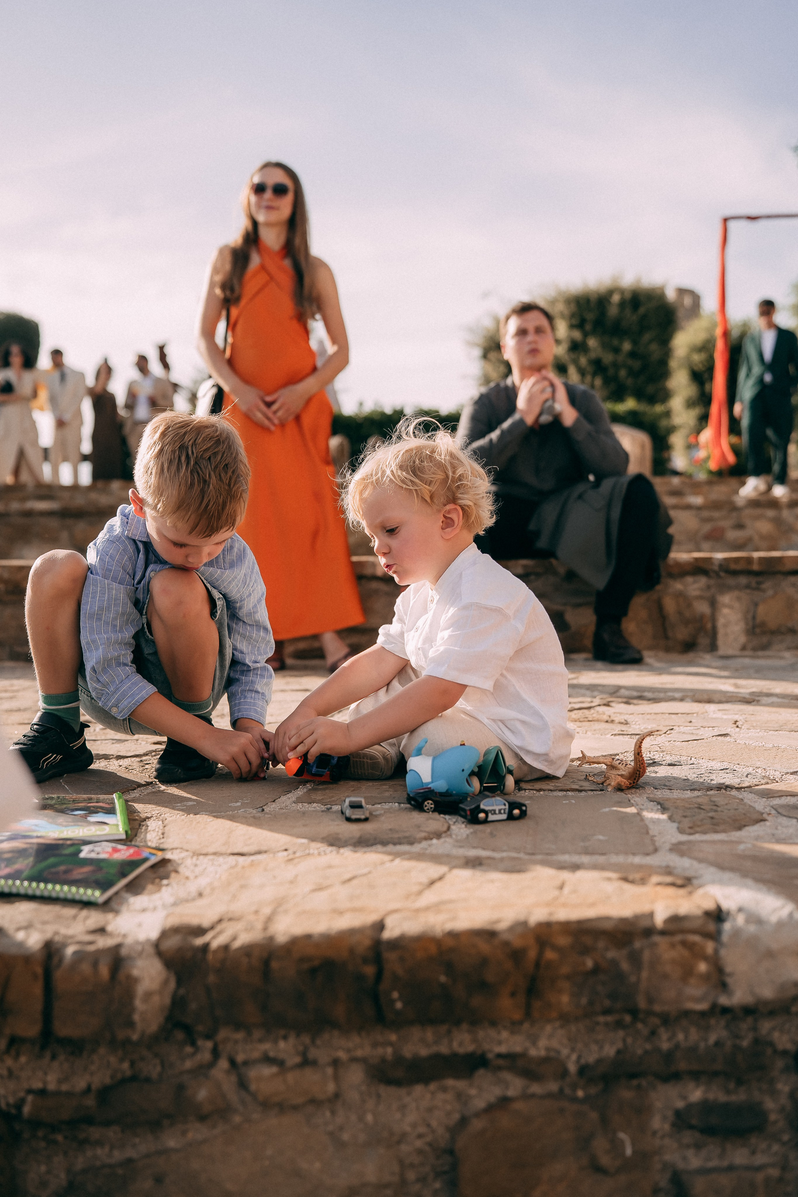 Children playing on the castle wall during the wedding celebration
