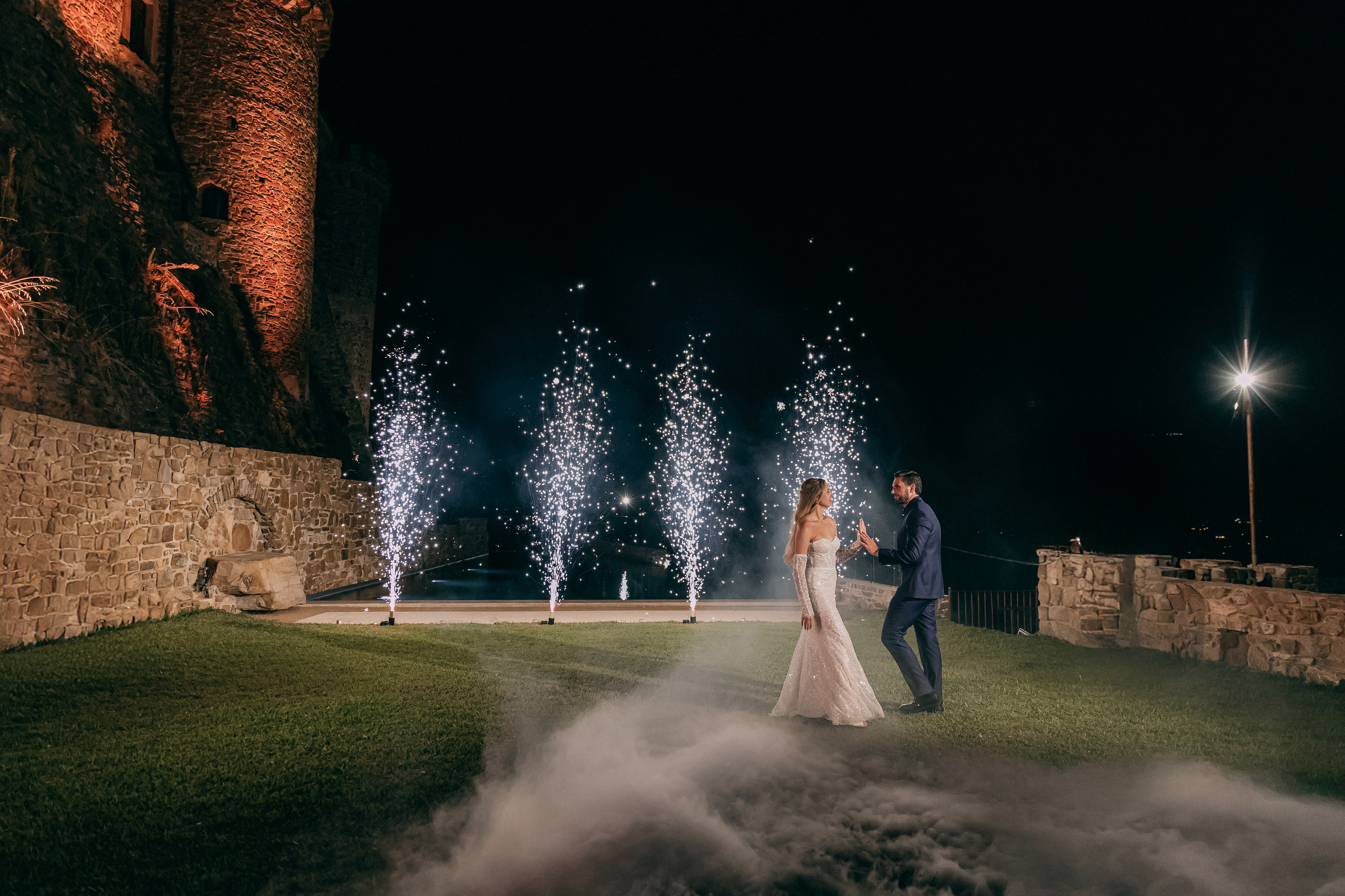 First dance with cold sparkler fountains in front of the castle