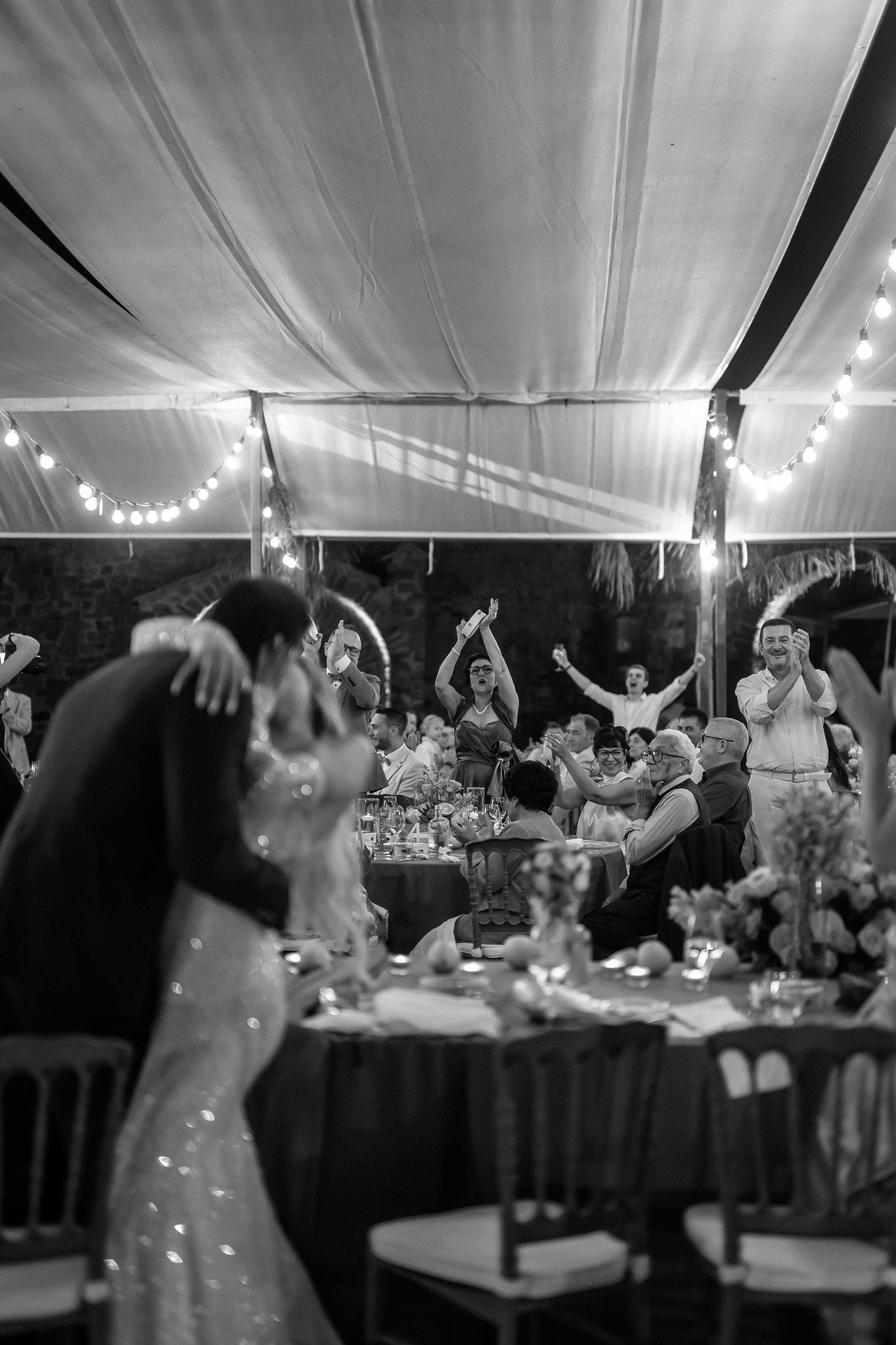 Black and white photo of the first dance under the marquee lights