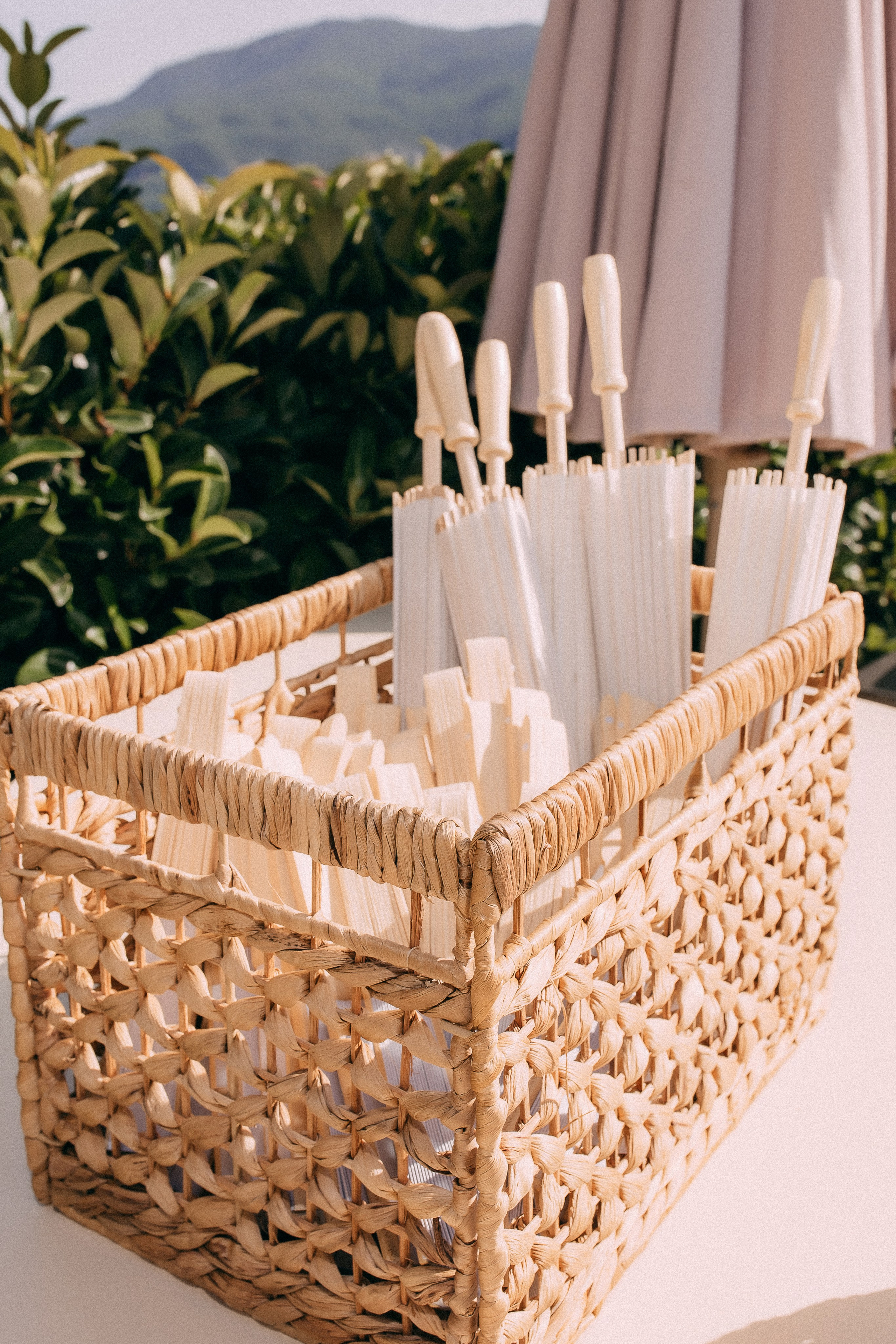 Basket of wedding fans prepared for guests at the ceremony