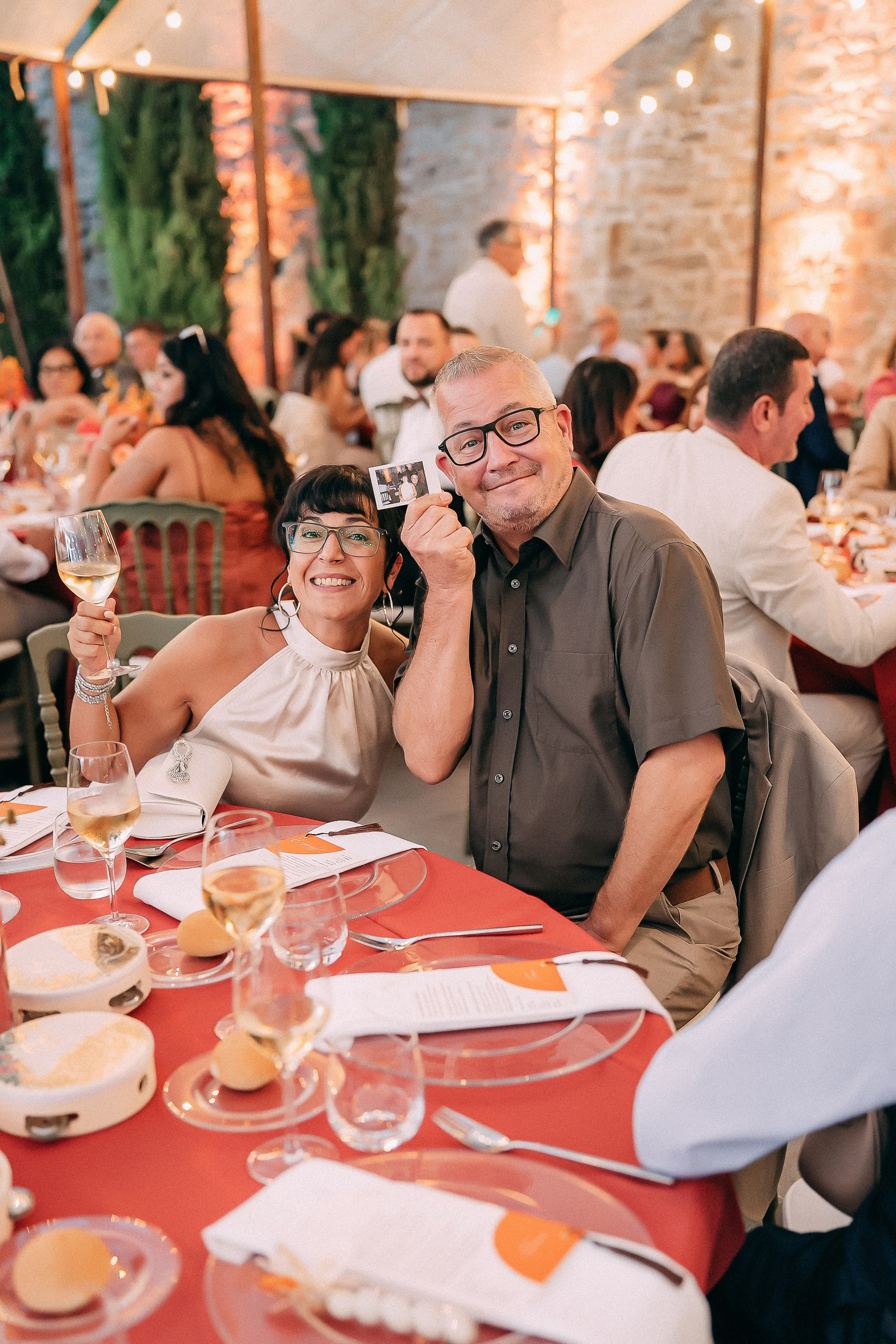 Guests toasting at the reception table at the Italian wedding