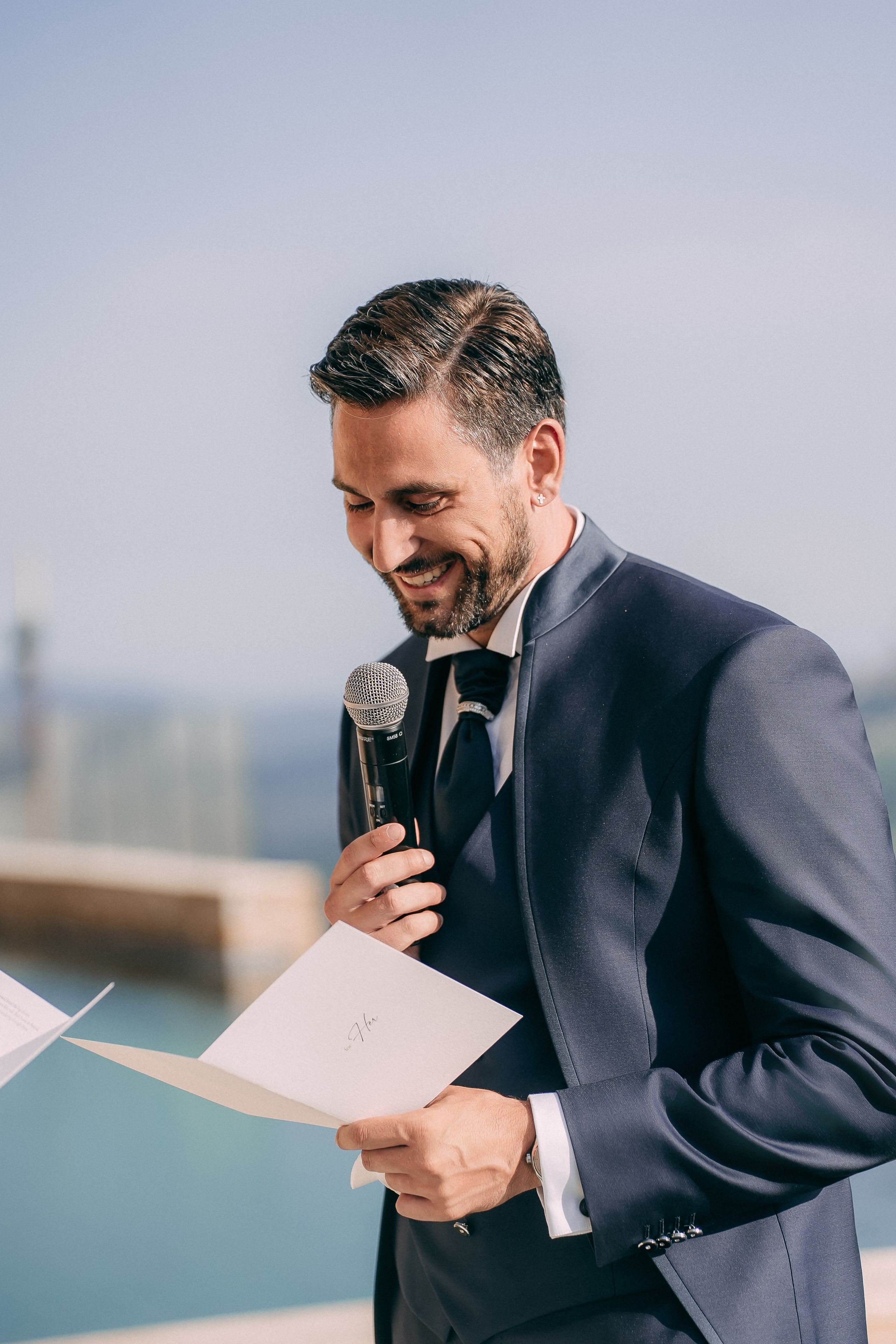 Guest giving an emotional speech during the wedding ceremony