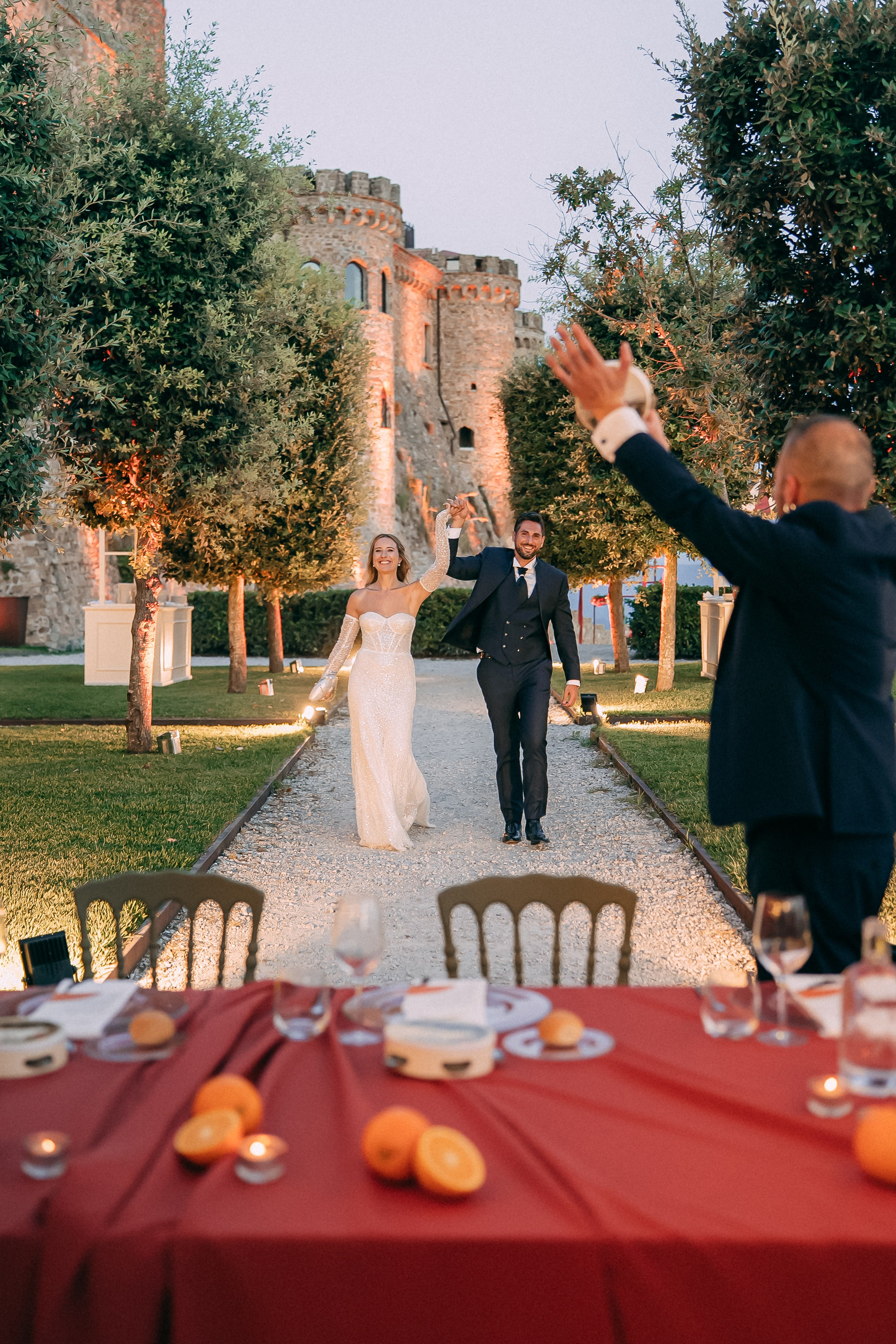 Bride and groom entering the reception to applause from their guests