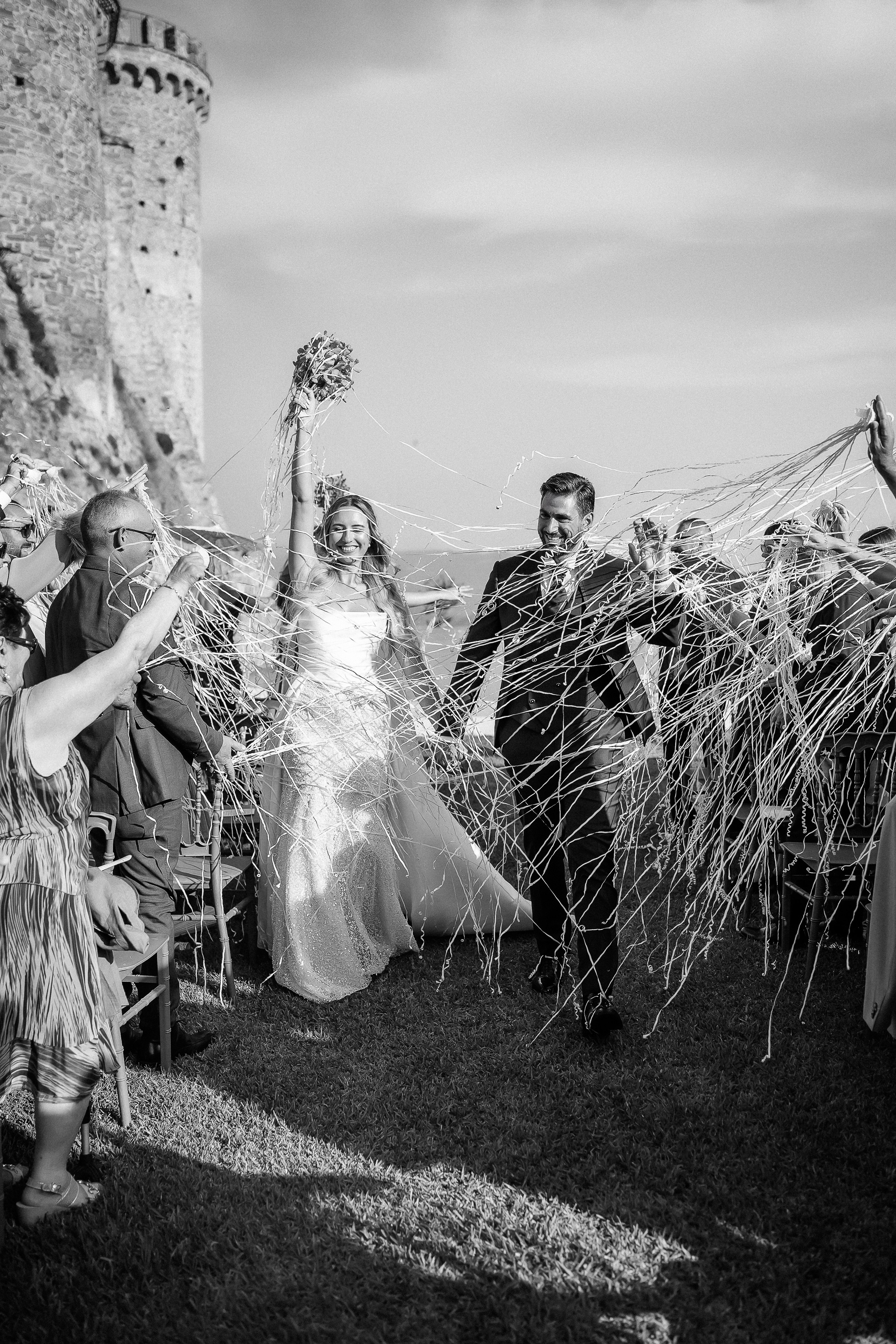 Confetti shower for the newlyweds after the ceremony, in black and white