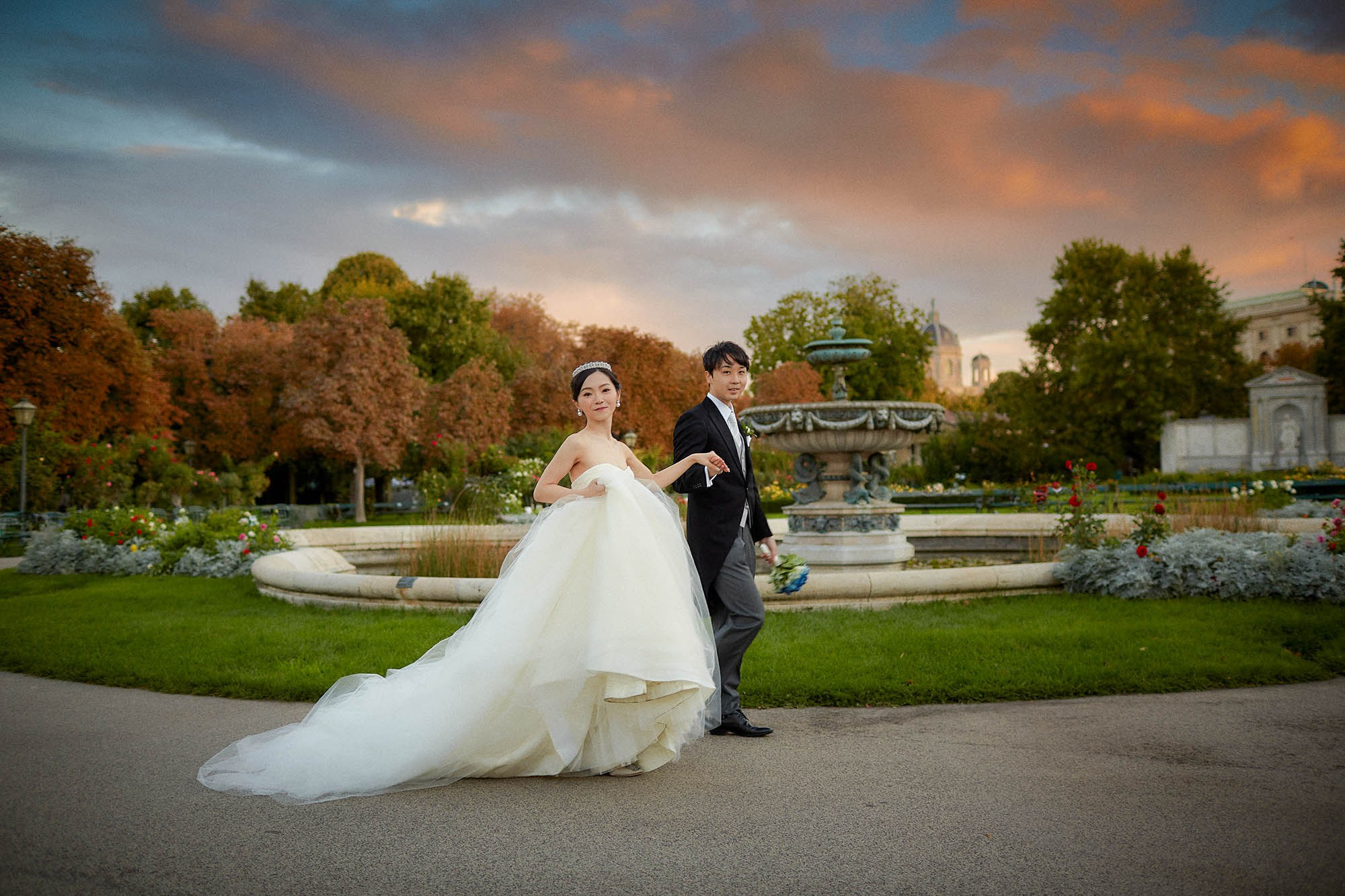 Bride smiling with wedding dress blowing in wind Vienna.