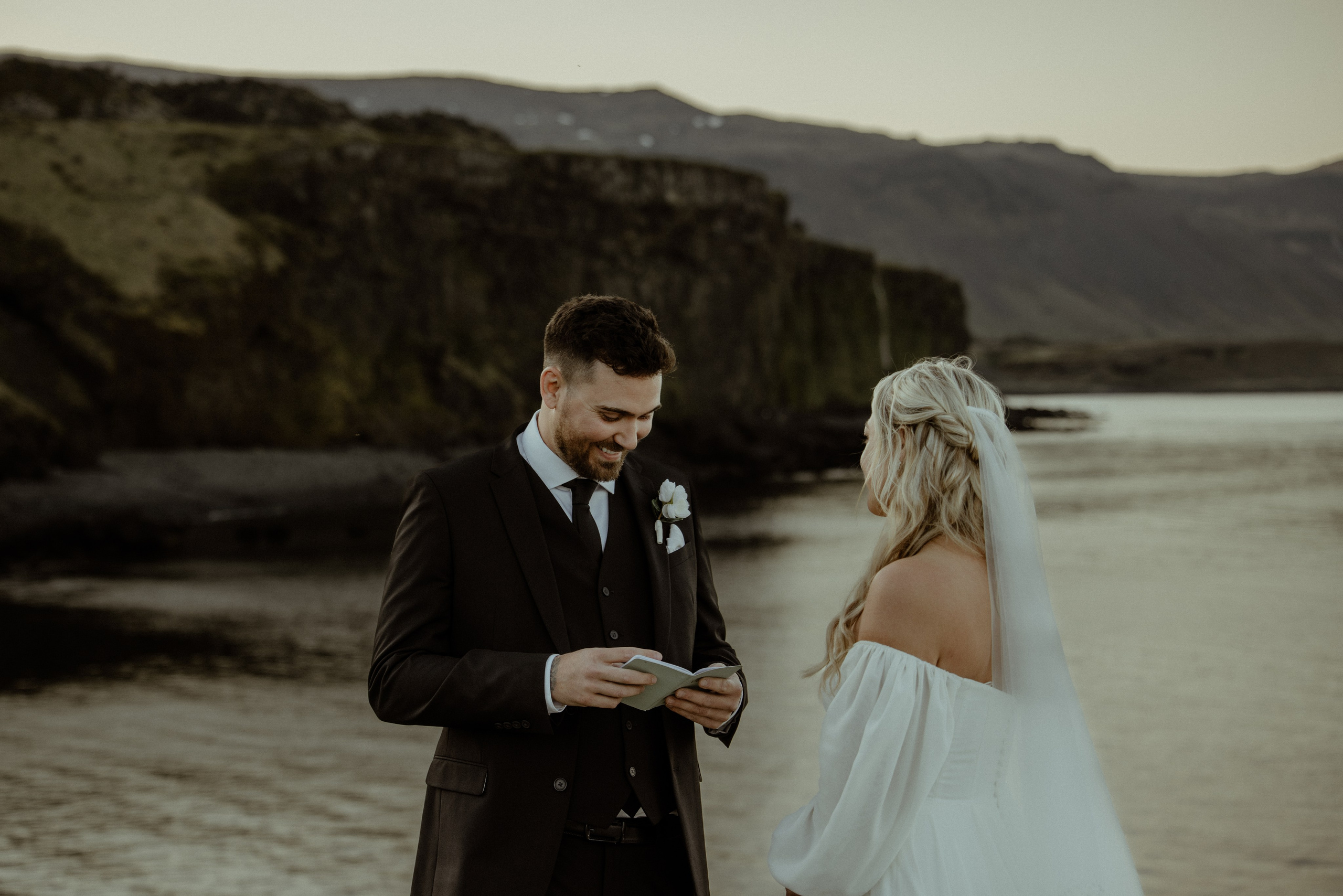 Iceland elopement at Budir with midnight sun wedding photos at black sand beach. Iceland elopement photographer & videographer