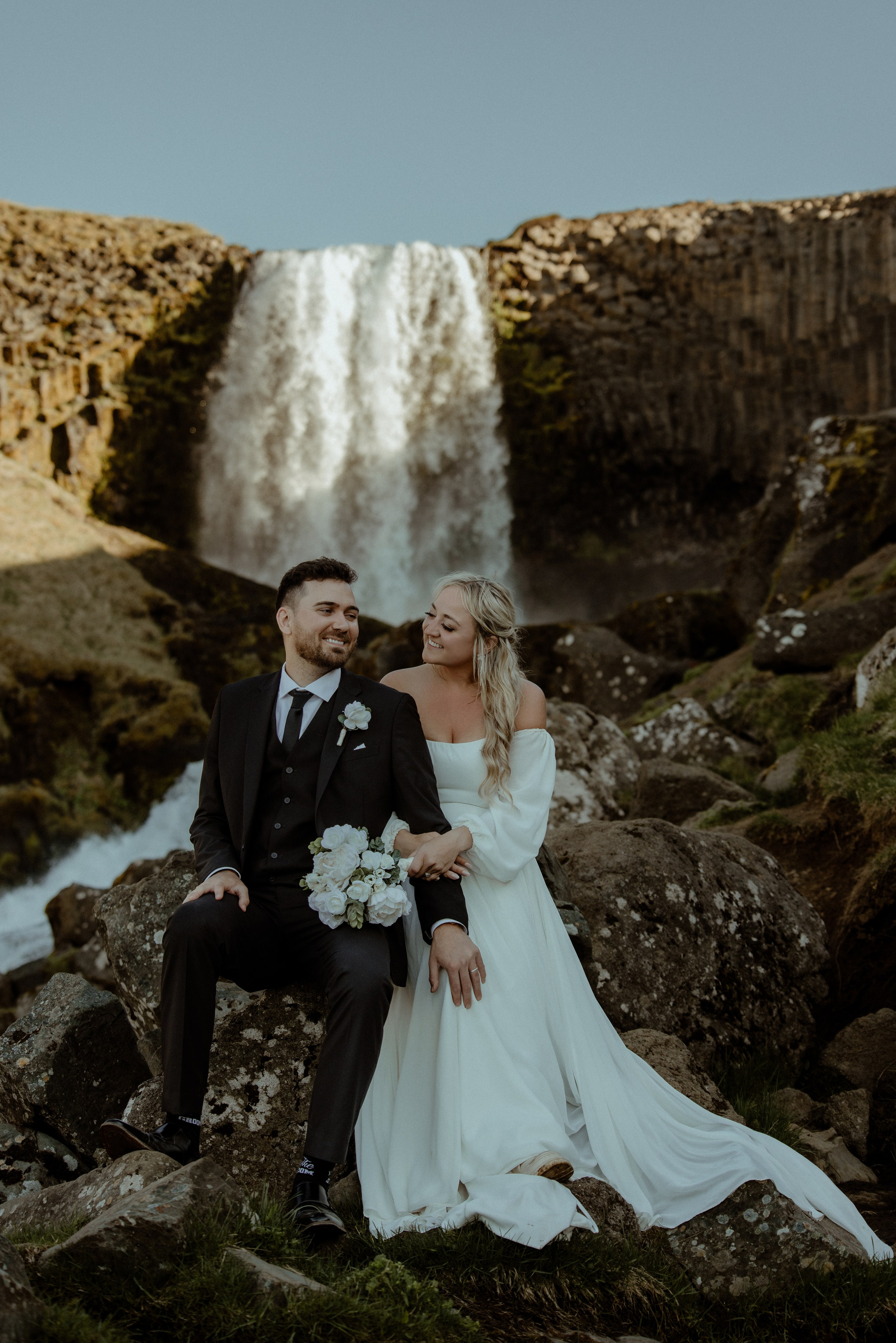 Iceland elopement at Budir with midnight sun wedding photos at black sand beach. Iceland elopement photographer & videographer