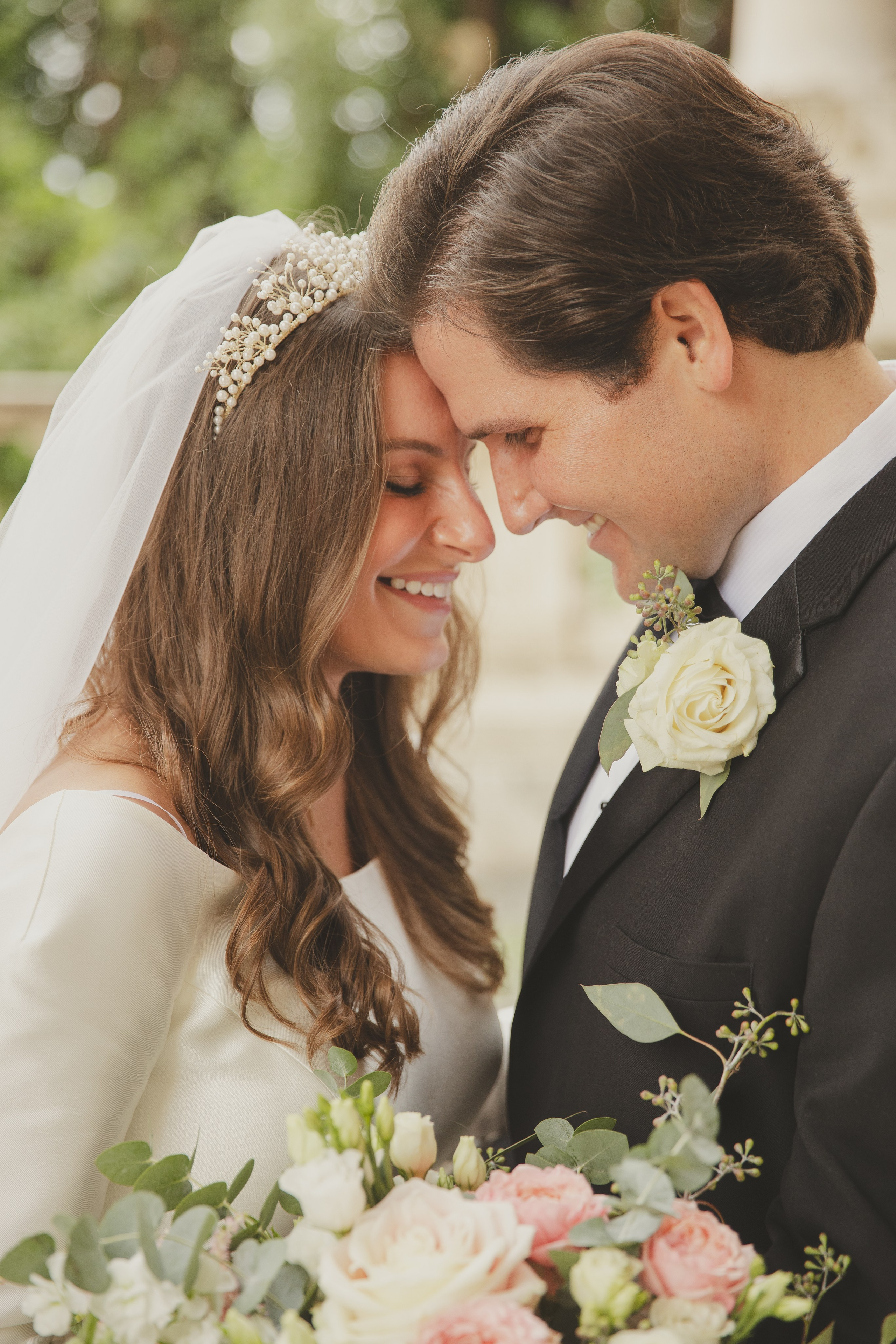 Newly married couple gazing into each other's eyes in the arcades of Piazza del Campidoglio.