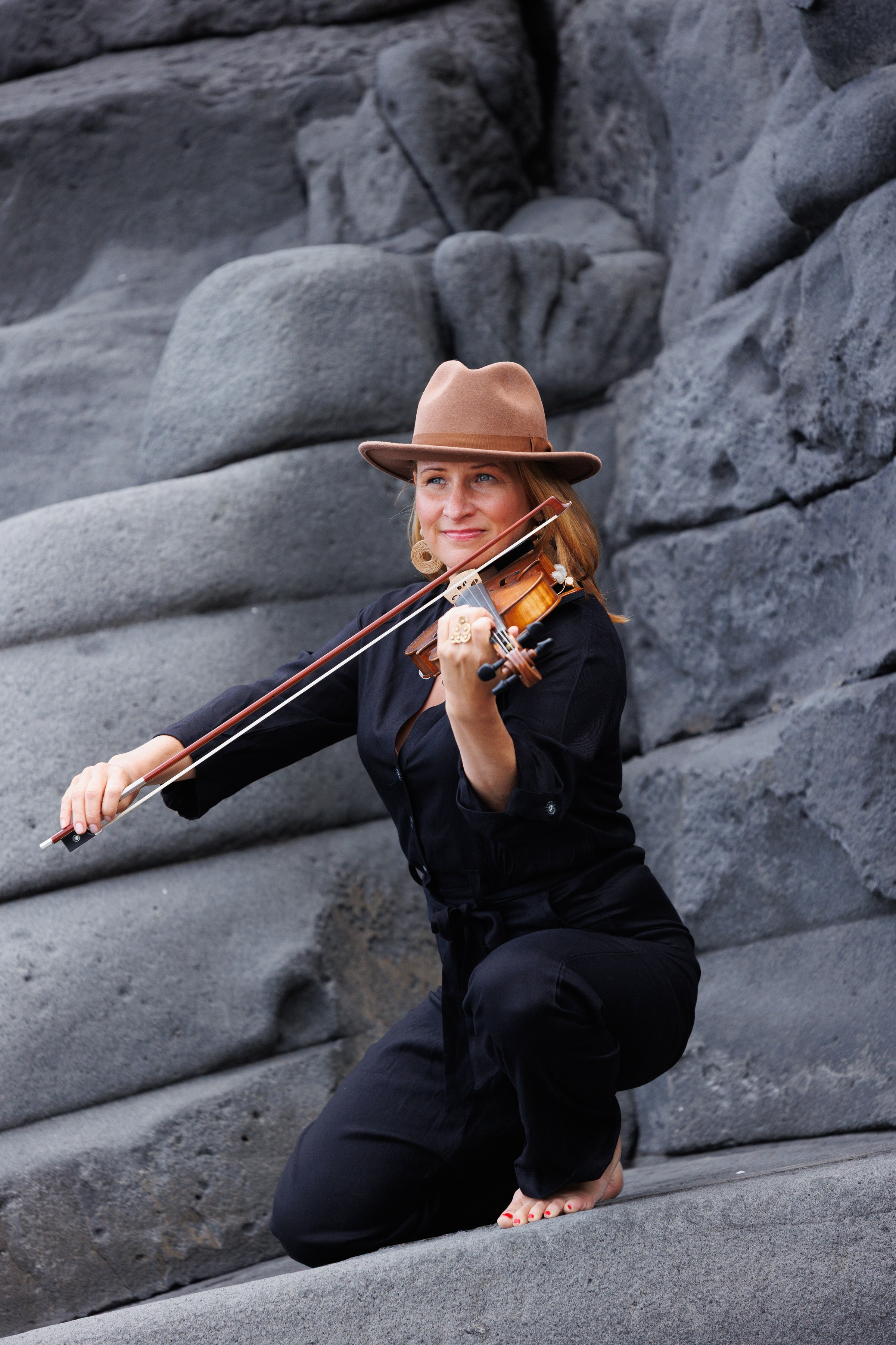 Portrait photoshoot in stone Gran Canaria with violin