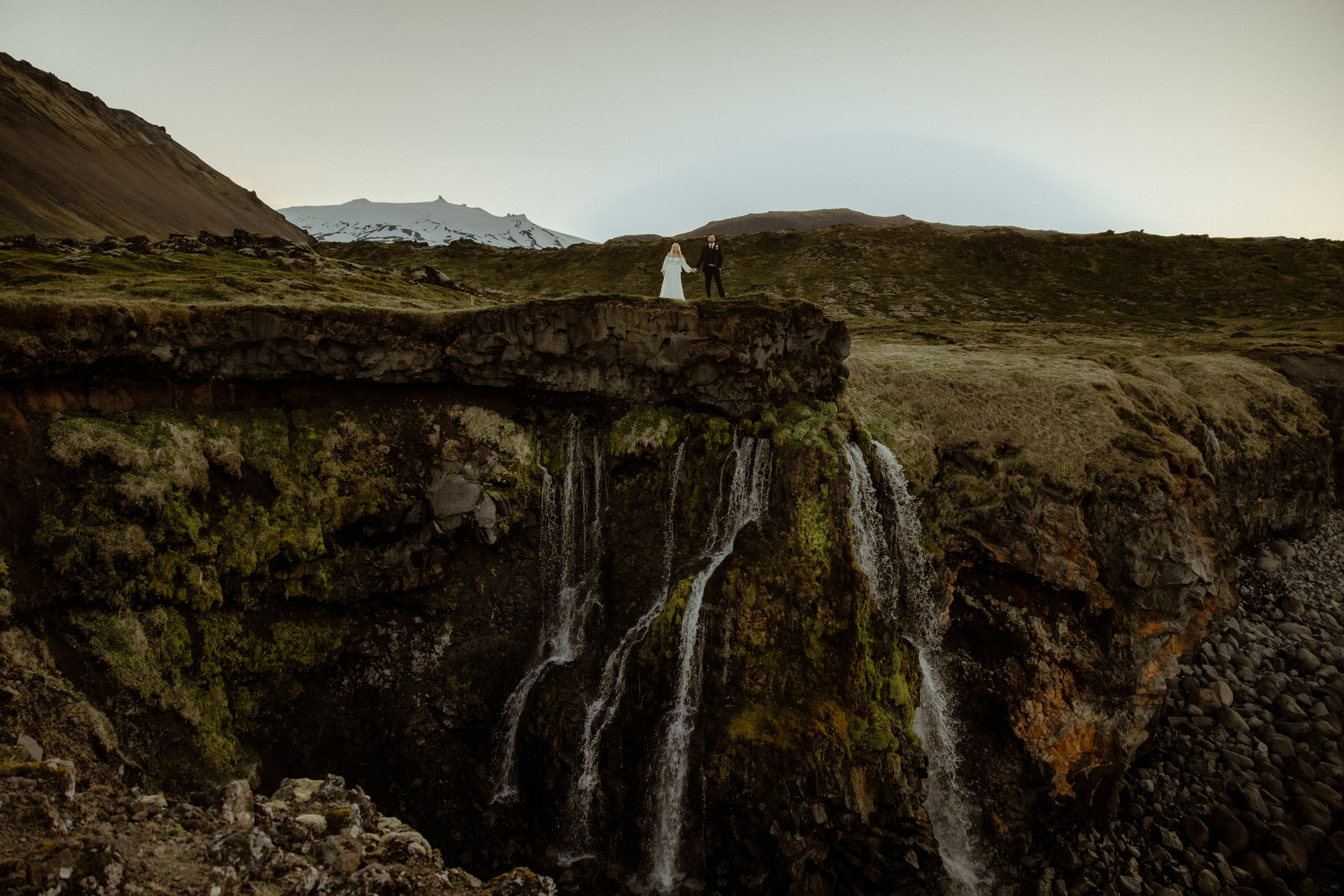 Iceland elopement at Budir with midnight sun wedding photos at black sand beach. Iceland elopement photographer & videographer