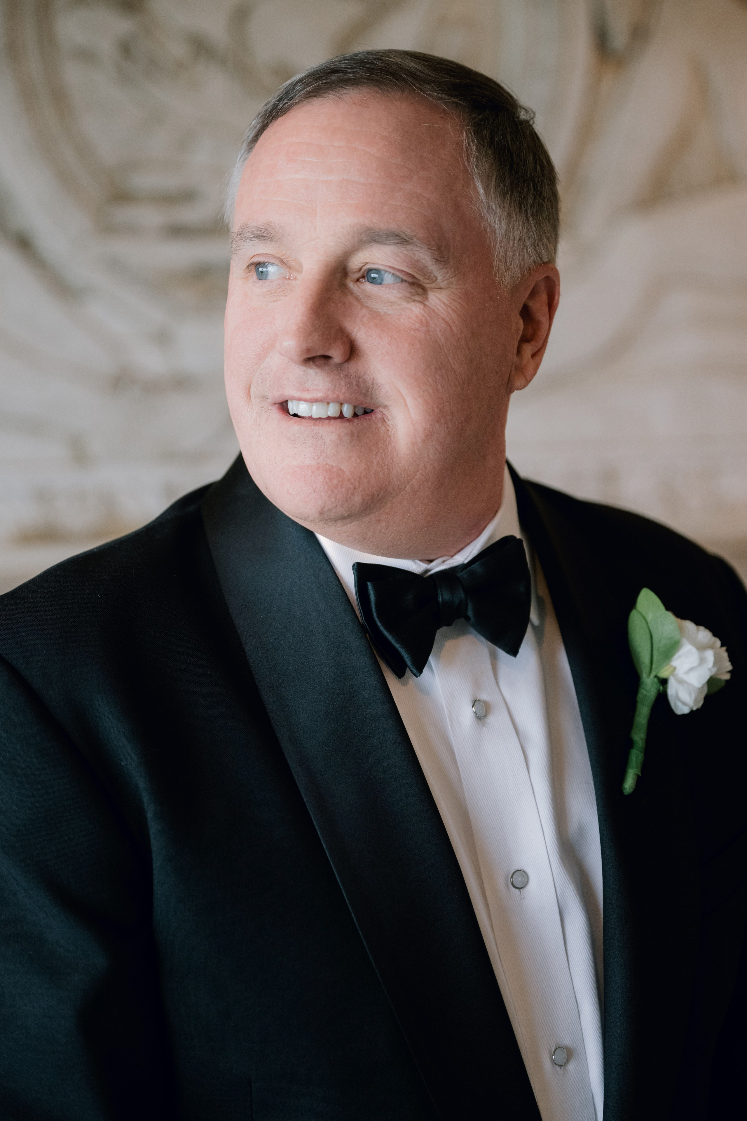 a man in a tuxed suit and bow tie